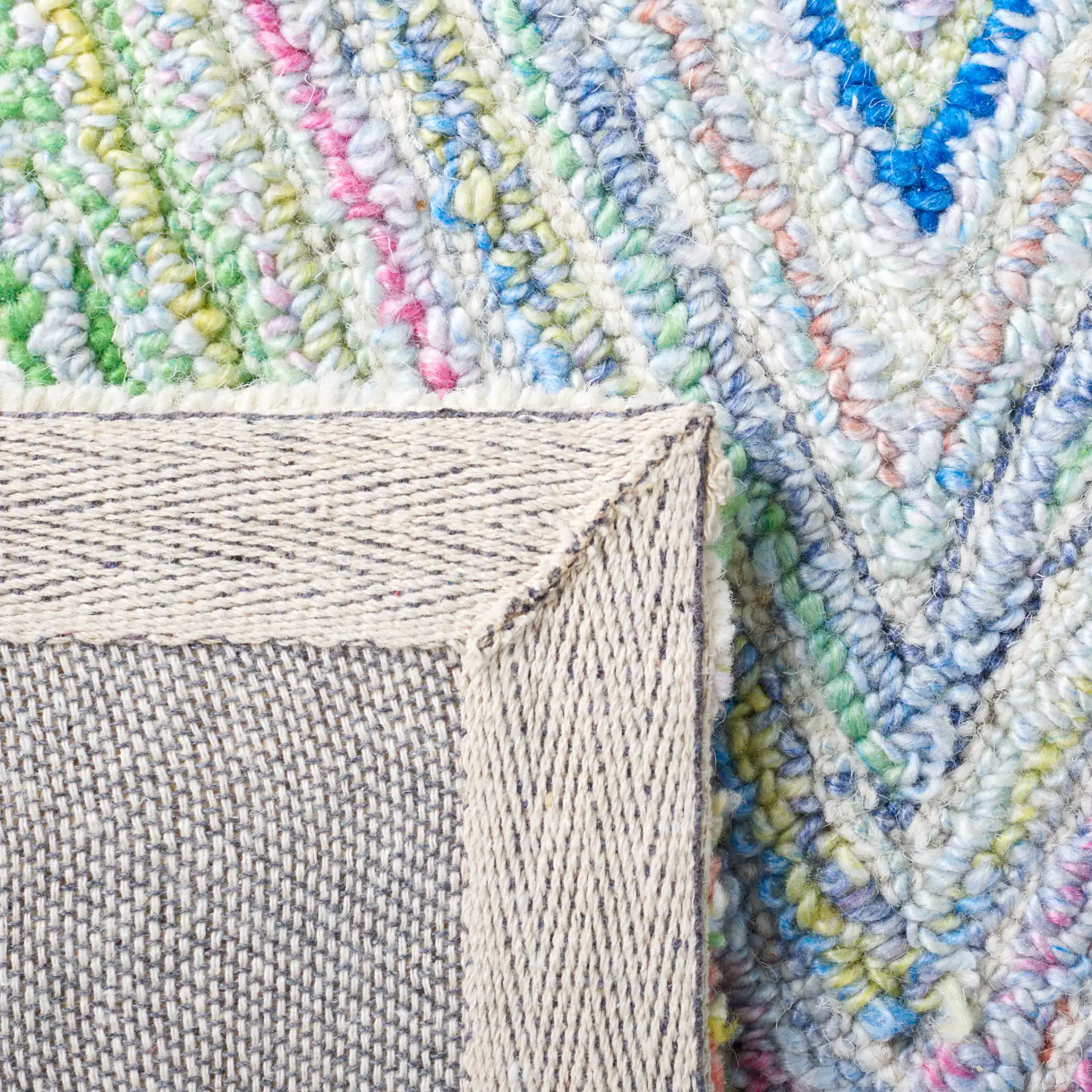 Metro Concentric Diamond Hand-Tufted Rug in Blue / Green in a styled room