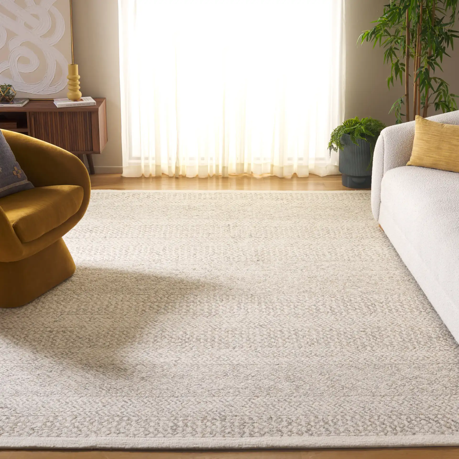 Metro Chevron Stripe Hand-Tufted Wool Rug in Ivory in a styled room