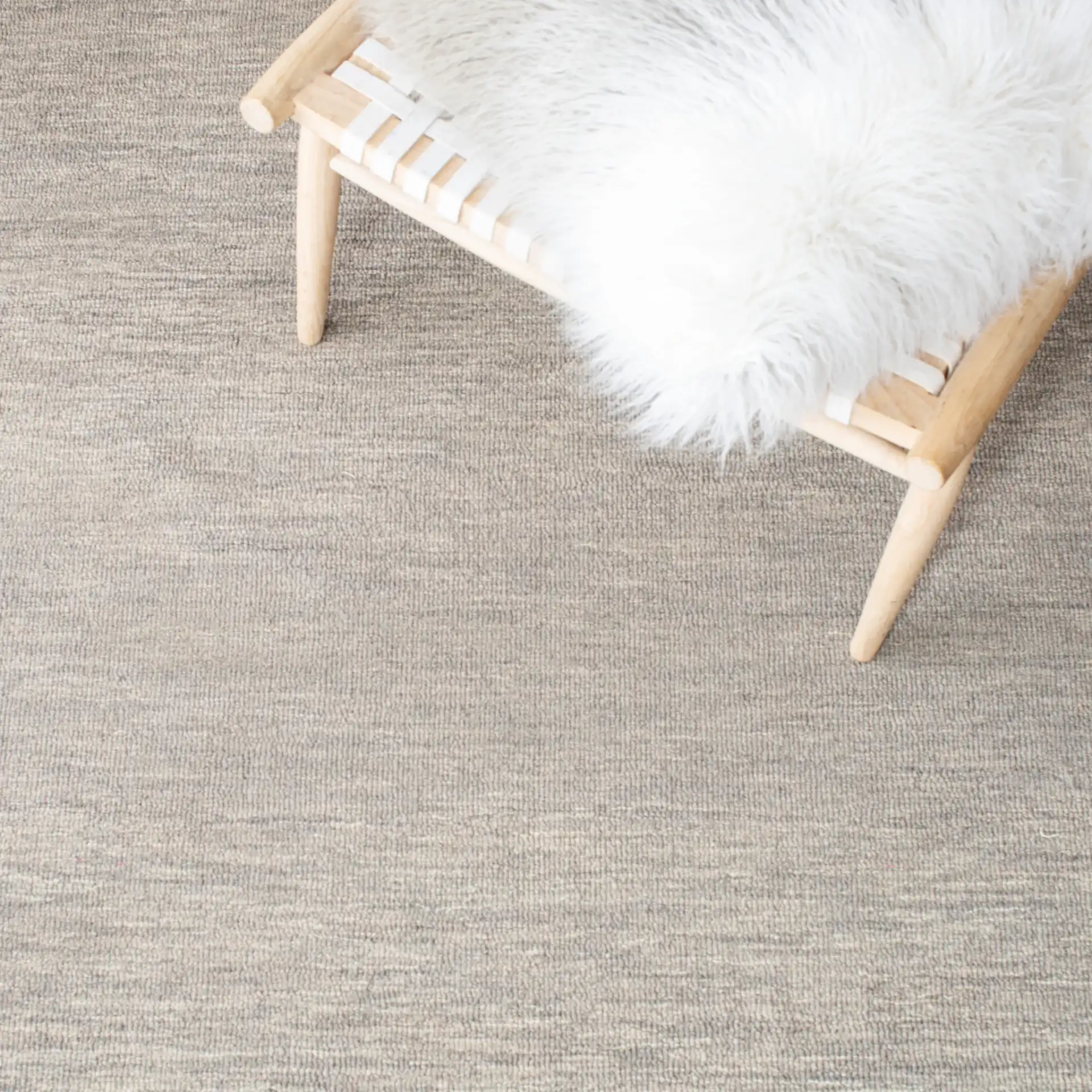 Metro Striped Border Hand-Tufted Wool Rug in Charcoal / Ivory in a styled room
