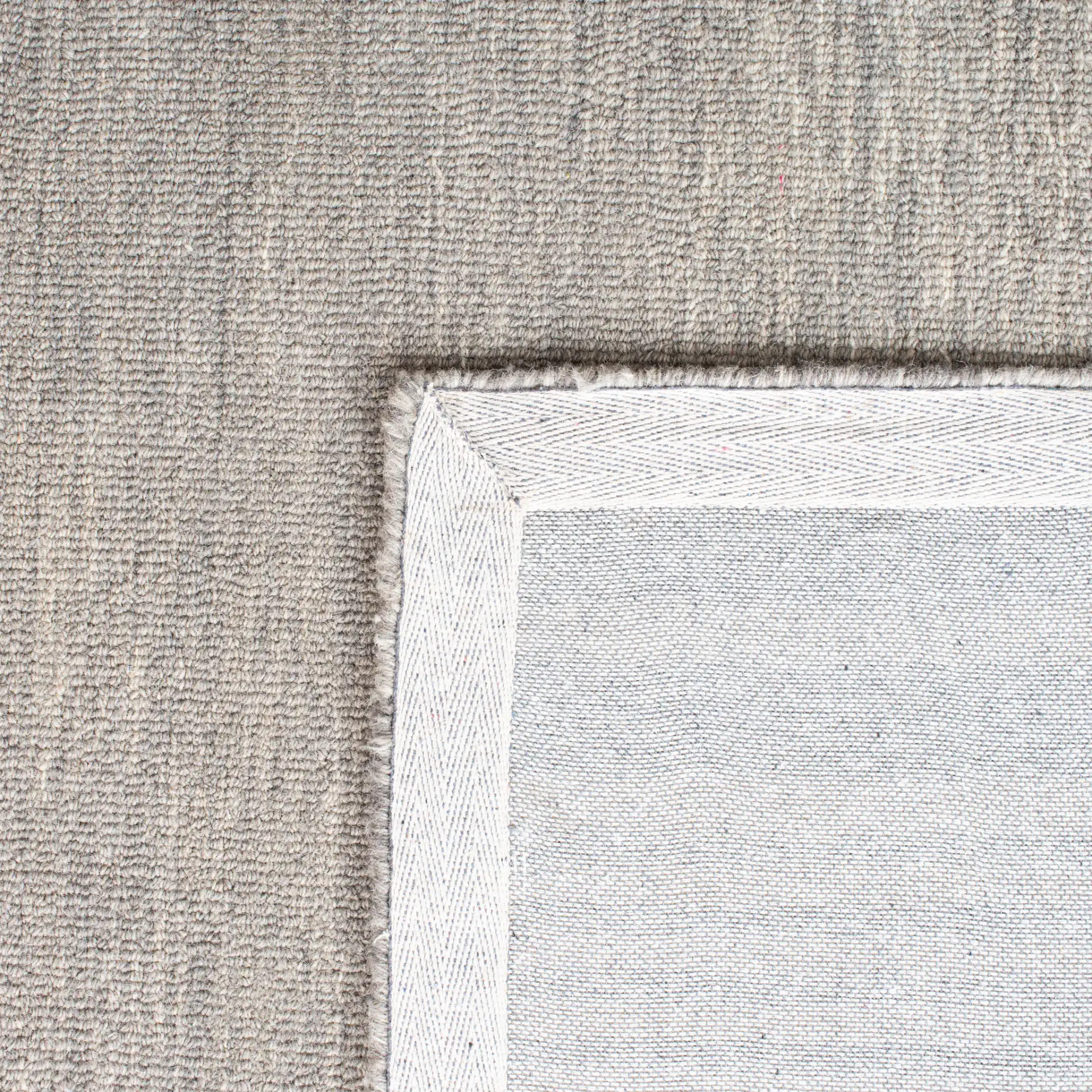 Metro Striped Border Hand-Tufted Wool Rug in Charcoal / Ivory in a styled room