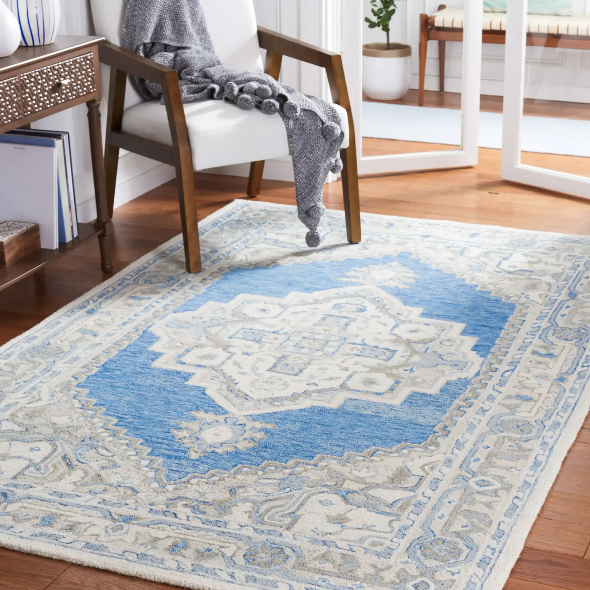Metro Stepped Medallion Hand-Tufted Wool Rug in Navy / Ivory in a styled room