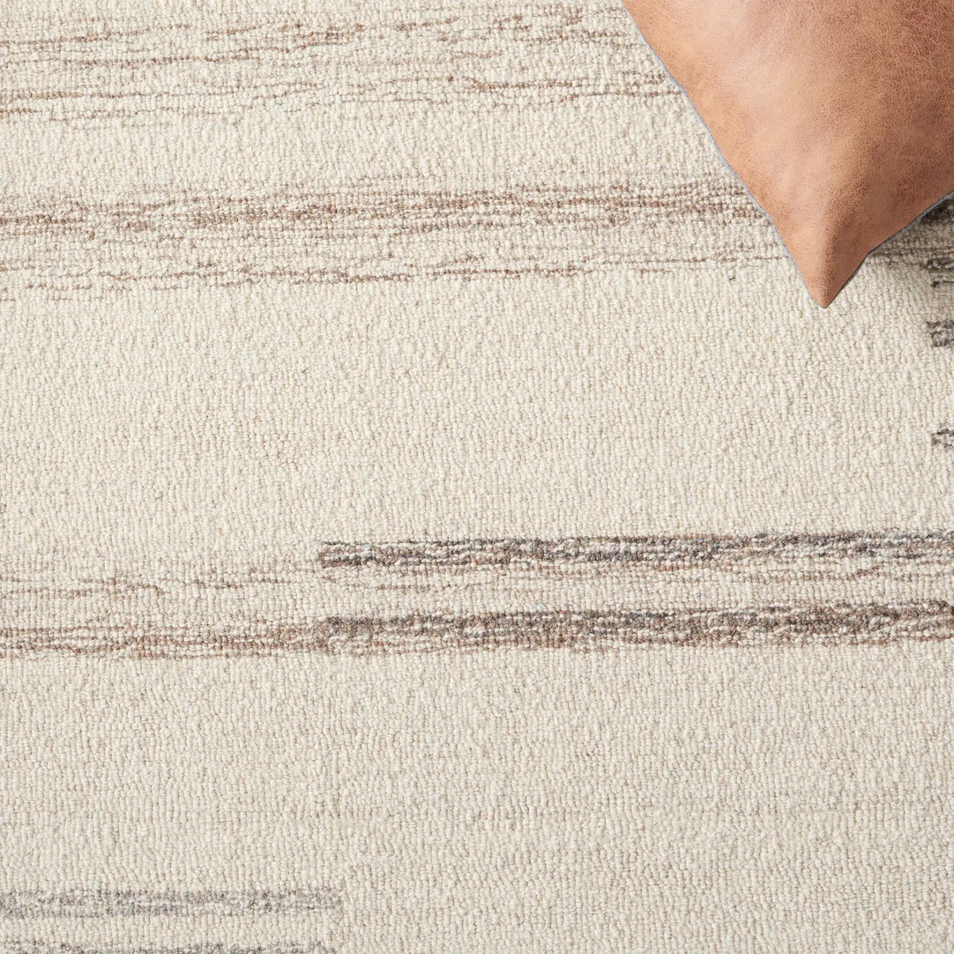 Metro Modern Broken Stripe Hand-Tufted Wool Rug in Ivory / Brown in a styled room