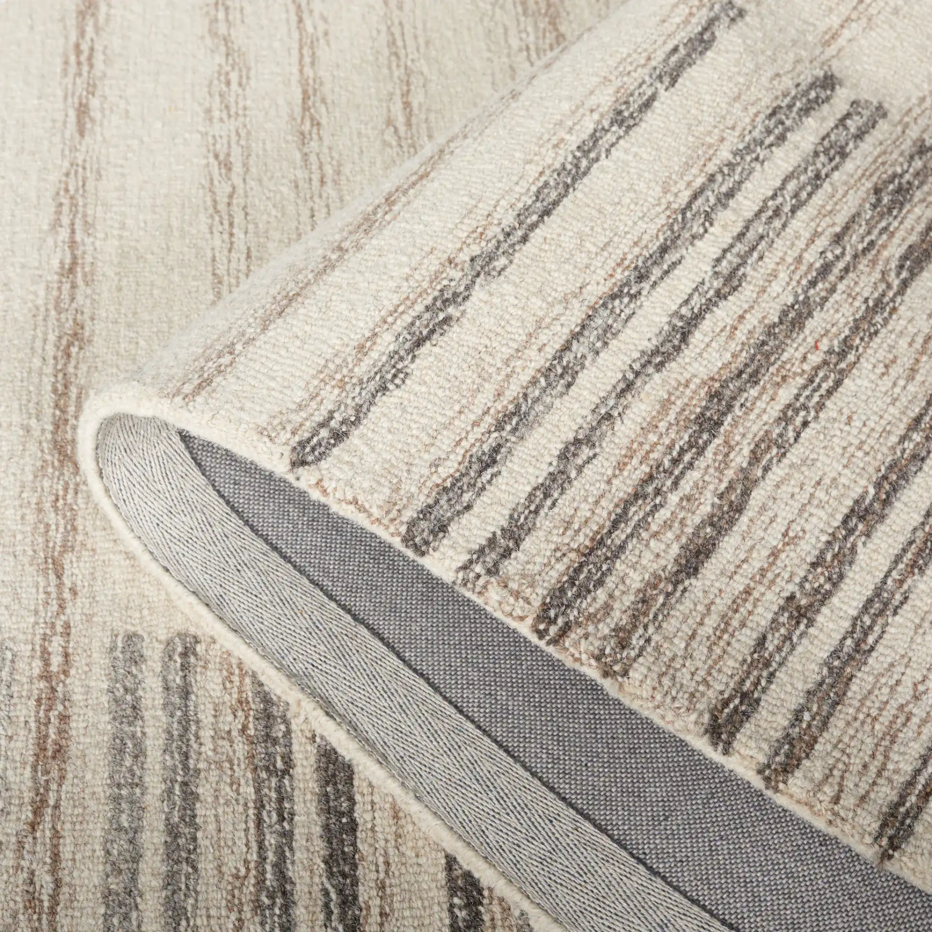 Metro Modern Broken Stripe Hand-Tufted Wool Rug in Ivory / Brown in a styled room