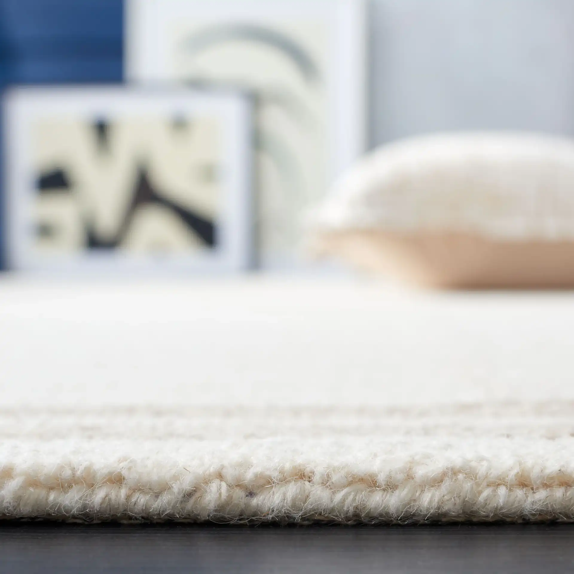 Metro Bordered Grid Hand-Tufted Wool Rug in Ivory / Brown in a styled room
