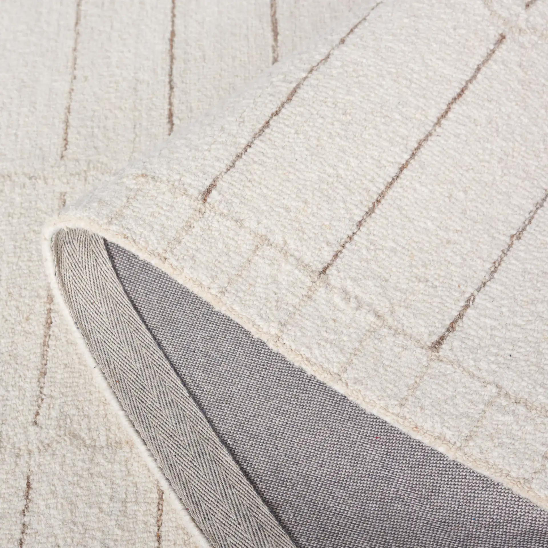 Metro Bordered Grid Hand-Tufted Wool Rug in Ivory / Brown in a styled room