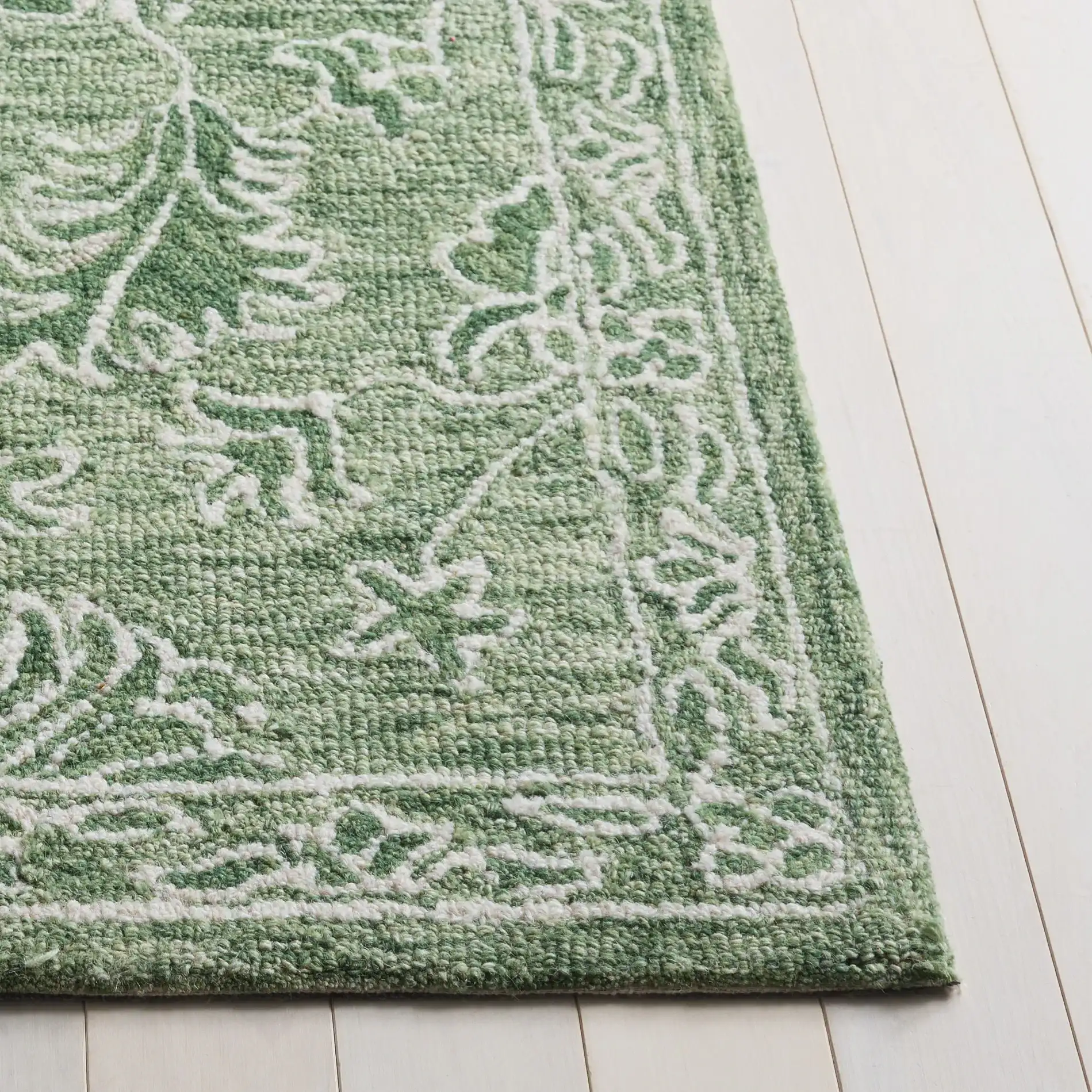 Metro Acanthus Scroll Hand-Tufted Wool Rug in Sage / Green in a styled room