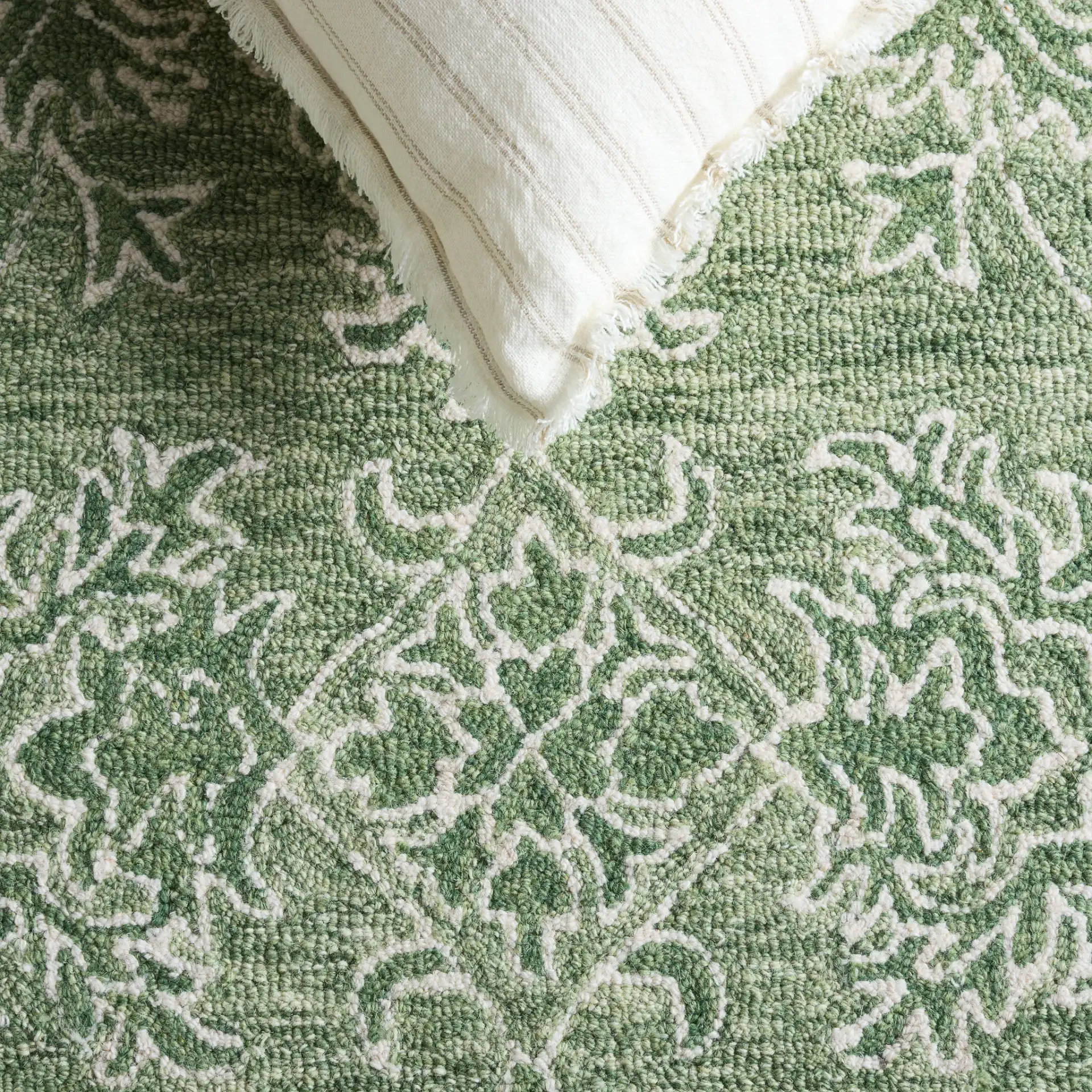 Metro Acanthus Scroll Hand-Tufted Wool Rug in Sage / Green in a styled room