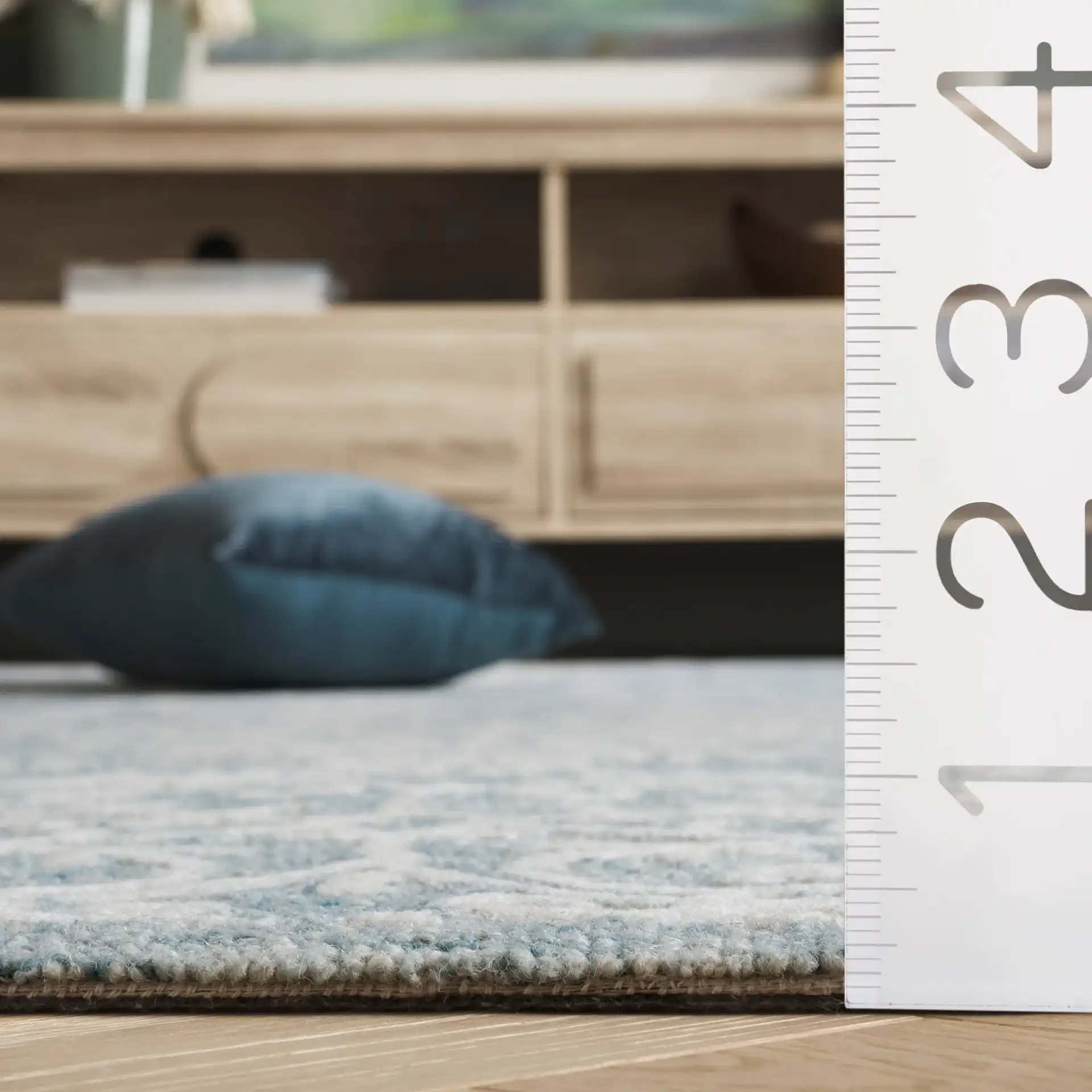 Metro Corner Medallion Hand-Tufted Wool Rug in Blue / Ivory in a styled room