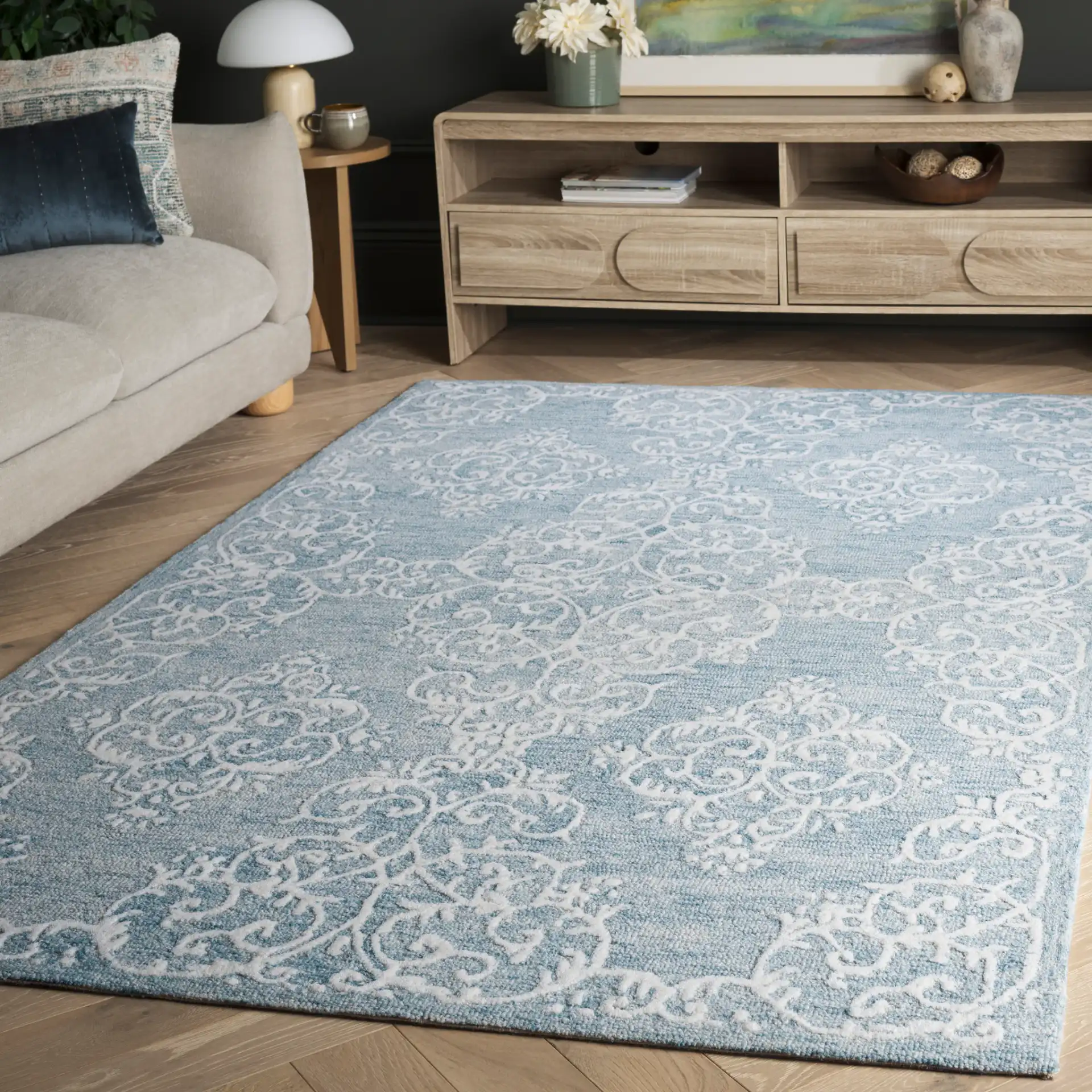 Metro Corner Medallion Hand-Tufted Wool Rug in Blue / Ivory in a styled room