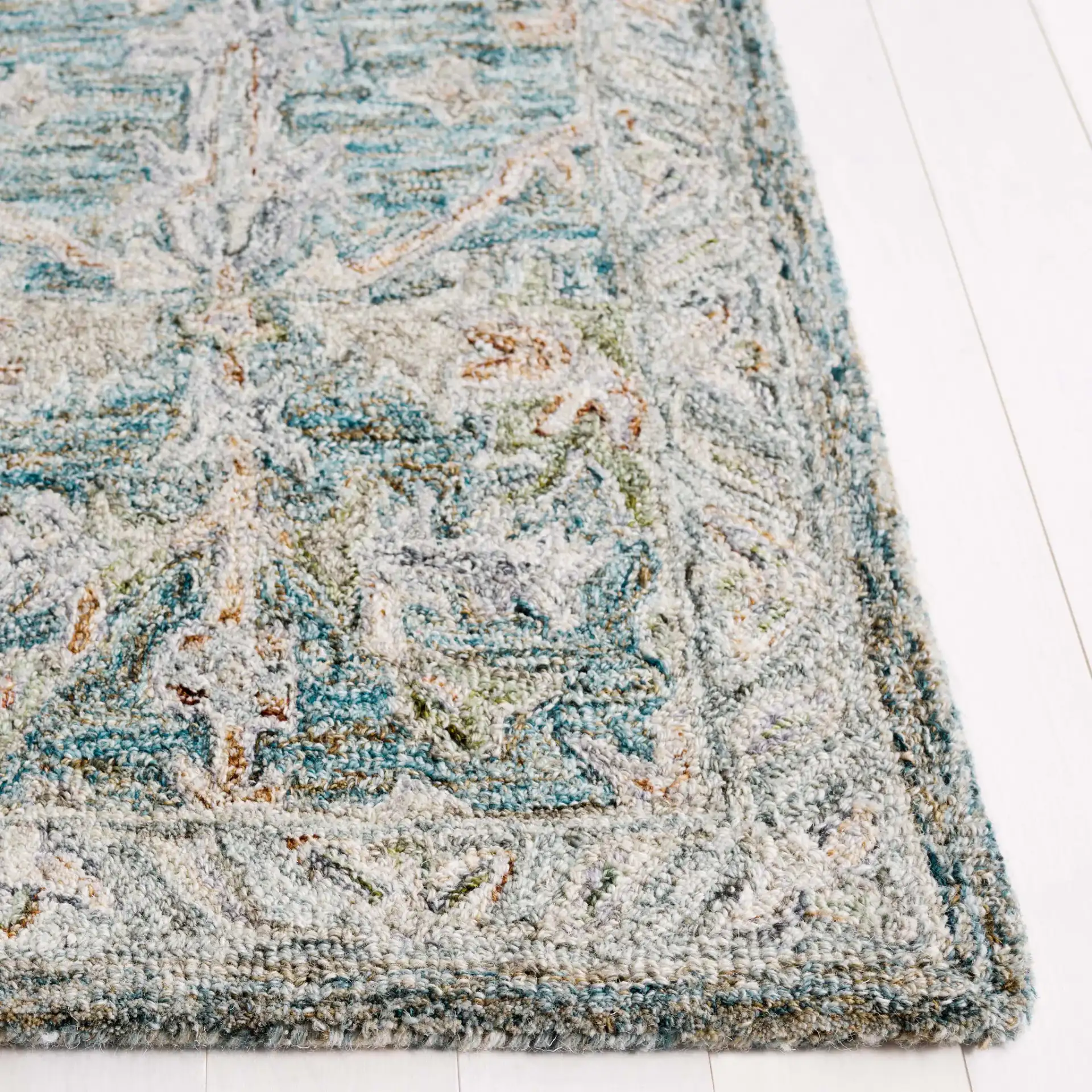 Metro Floral Trellis Hand-Tufted Wool Rug in Teal / Green in a styled room