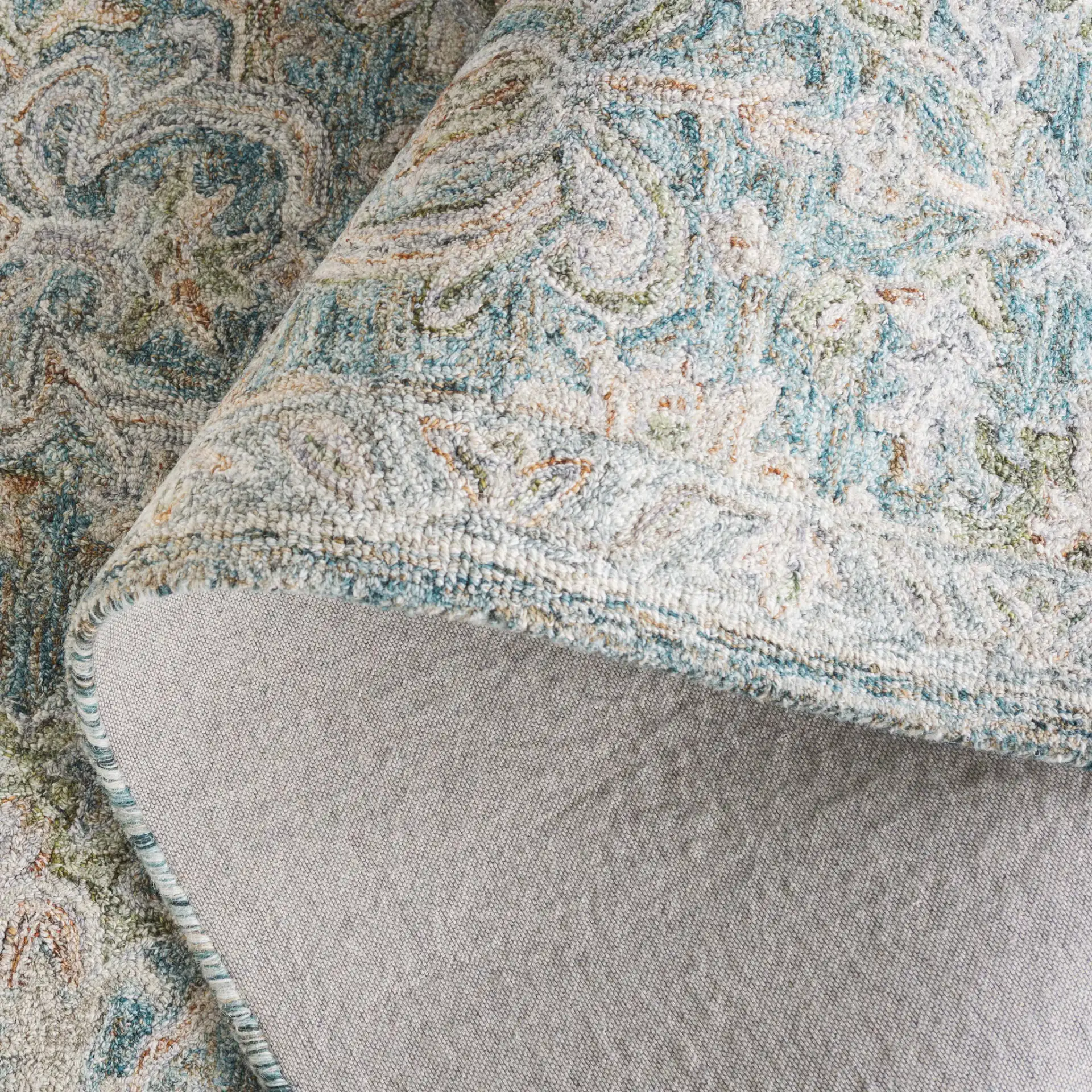 Metro Floral Trellis Hand-Tufted Wool Rug in Teal / Green in a styled room