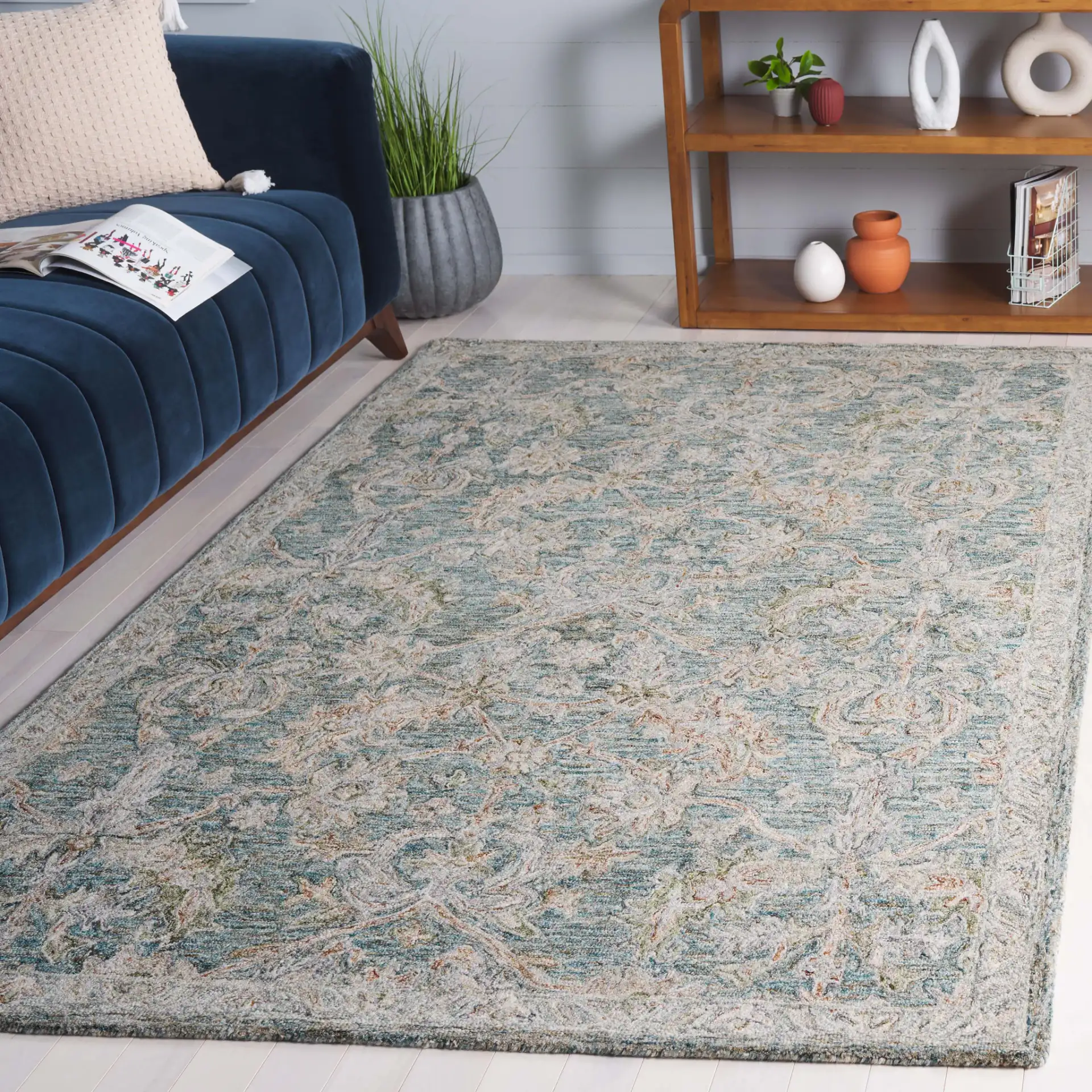 Metro Floral Trellis Hand-Tufted Wool Rug in Teal / Green in a styled room