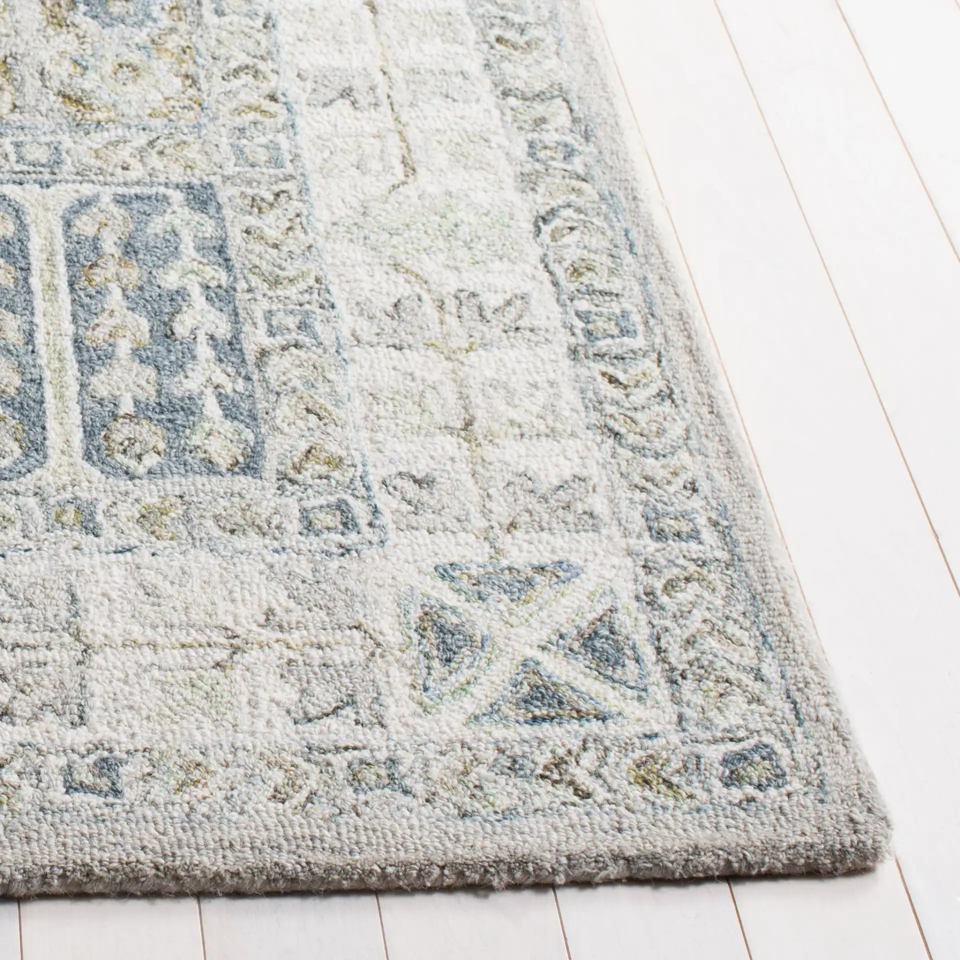 Metro Panel Grid Hand-Tufted Wool Rug in Gray / Beige in a styled room