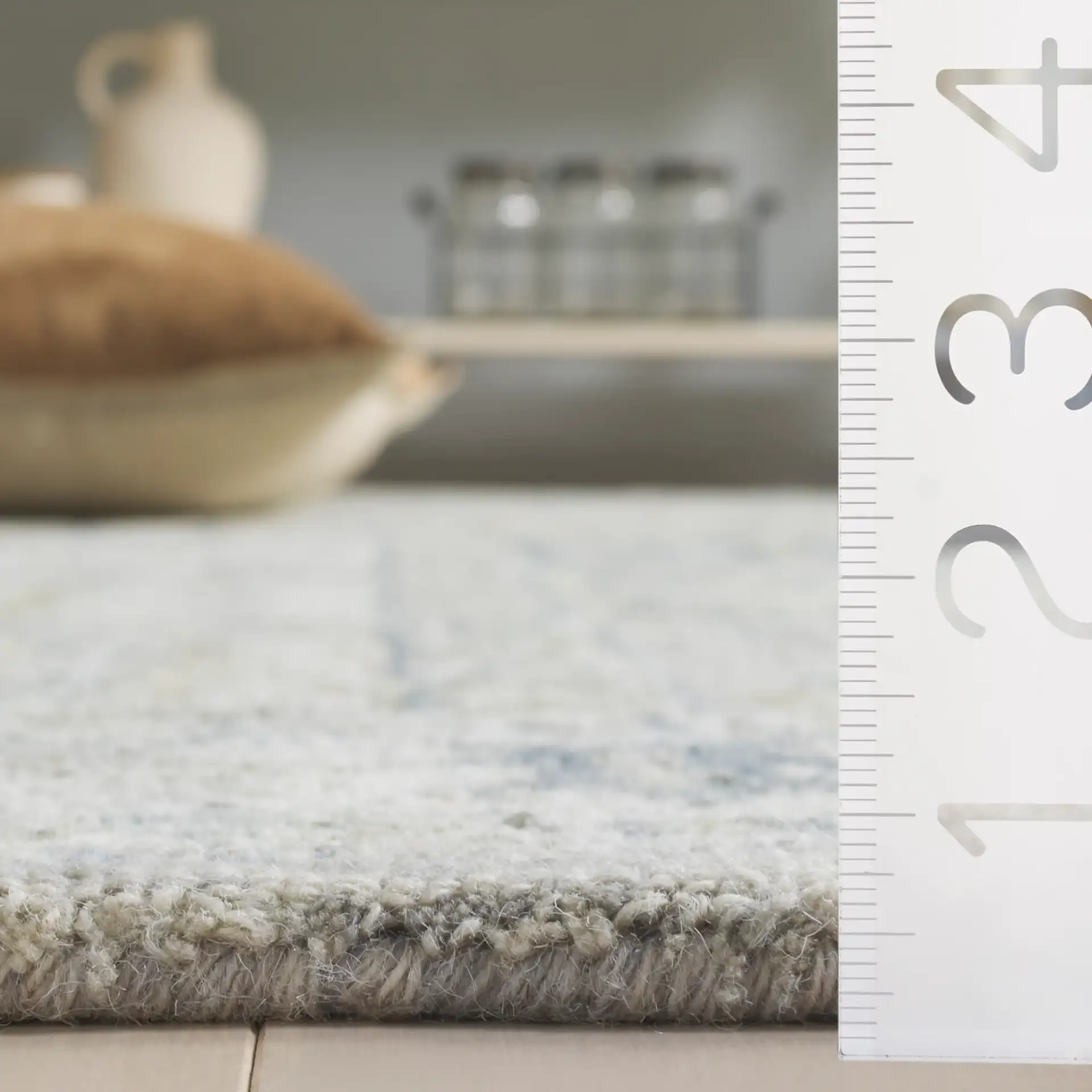 Metro Panel Grid Hand-Tufted Wool Rug in Gray / Beige in a styled room