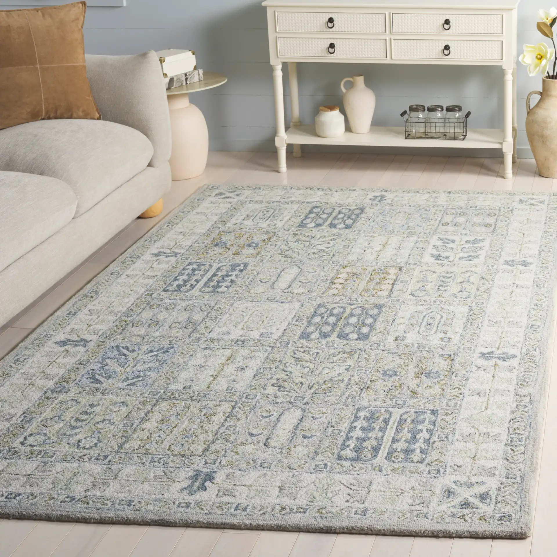 Metro Panel Grid Hand-Tufted Wool Rug in Gray / Beige in a styled room