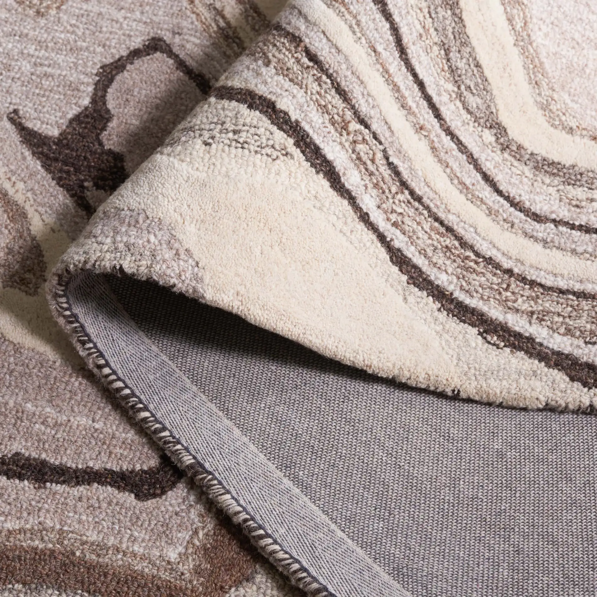 Metro Marble Hand-Tufted Wool Rug in Brown / Ivory in a styled room
