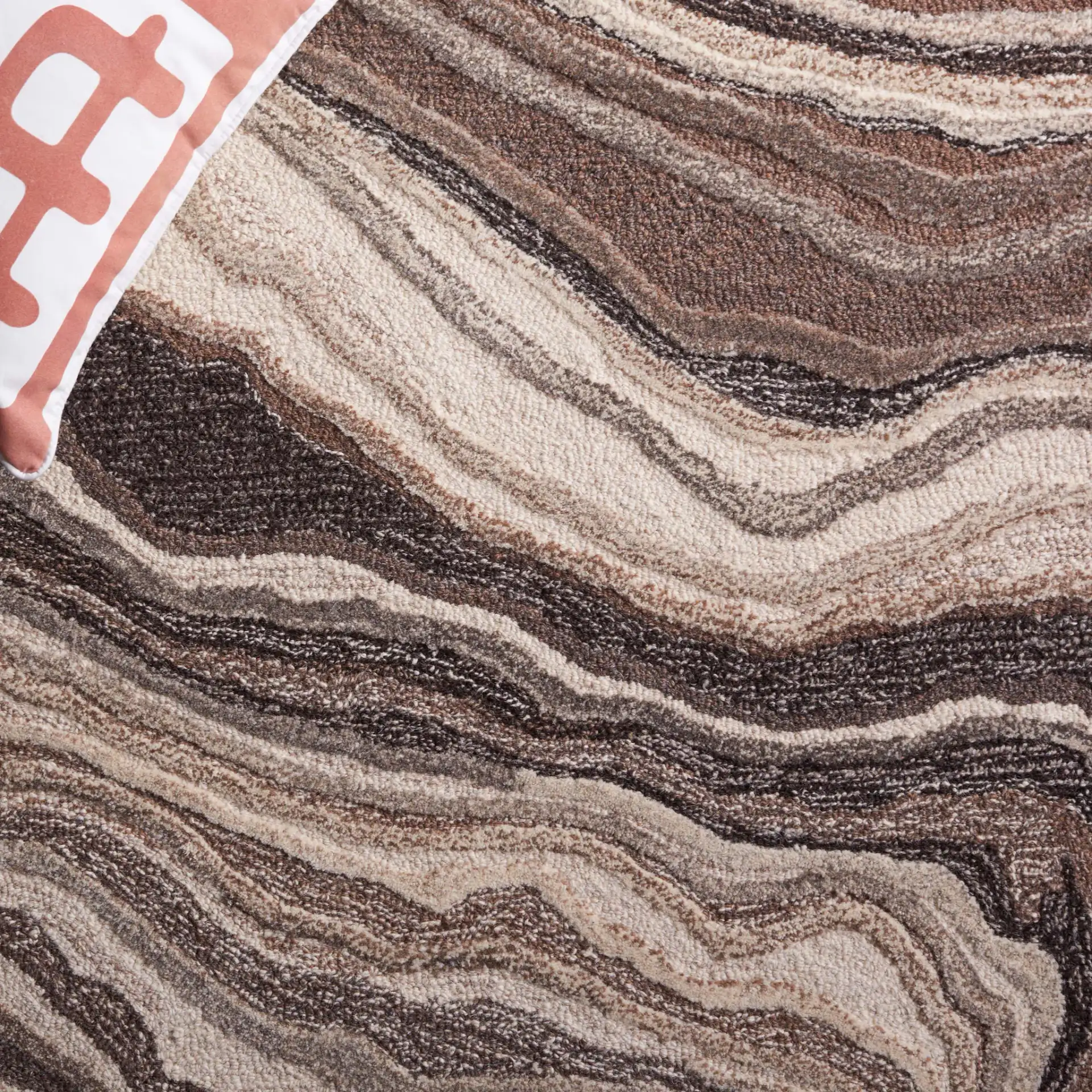 Metro Swirl Marble Hand-Tufted Wool Rug in Brown / Ivory in a styled room