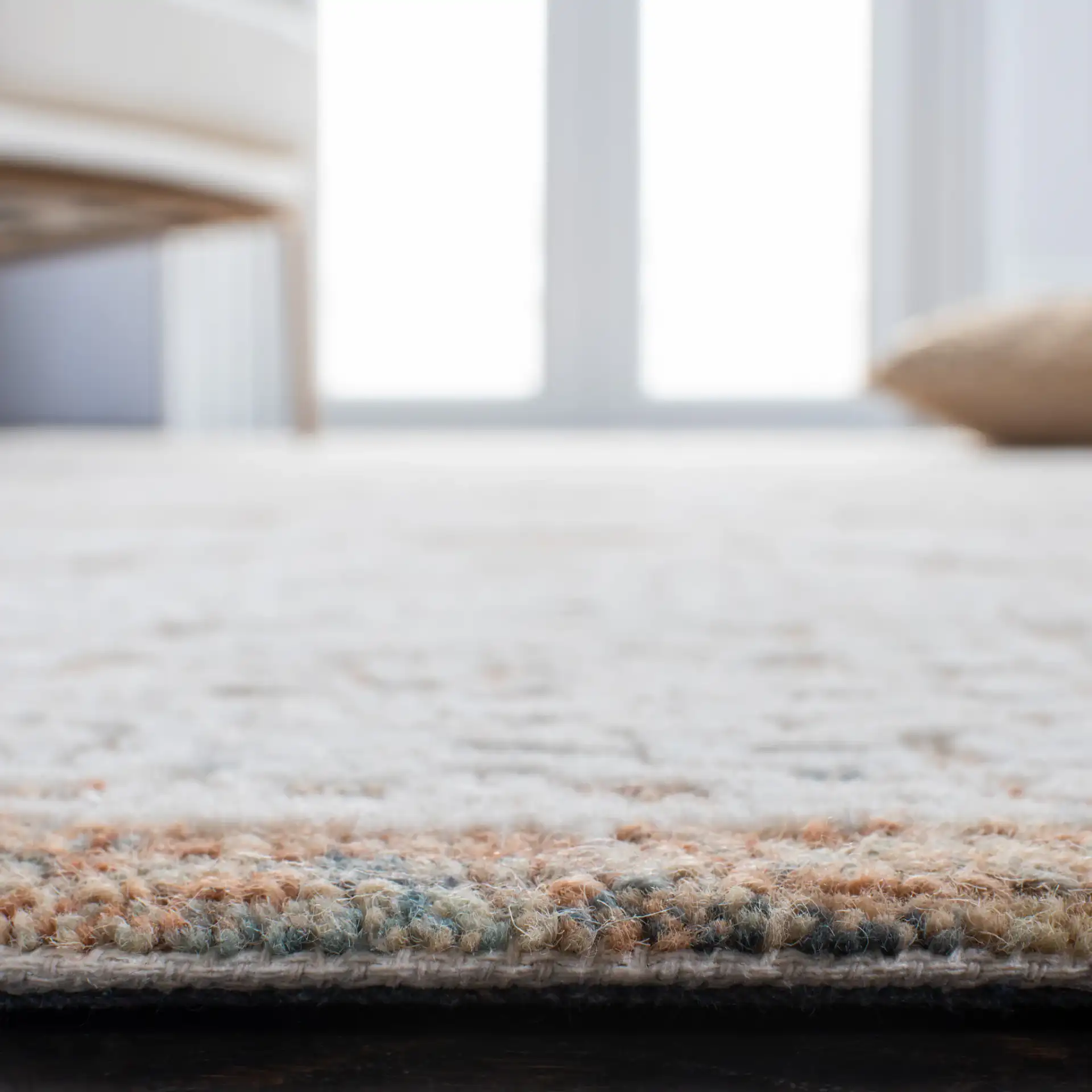 Metro Geometric Tile Hand-Tufted Wool Rug in Natural / Rust in a styled room