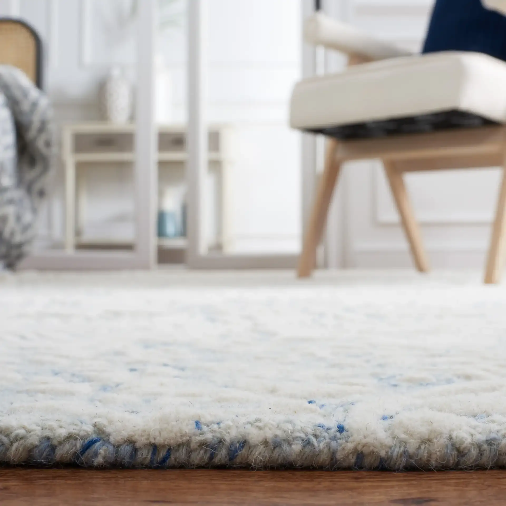 Metro Ornamental Damask Hand-Tufted Wool Rug in Blue / Ivory in a styled room