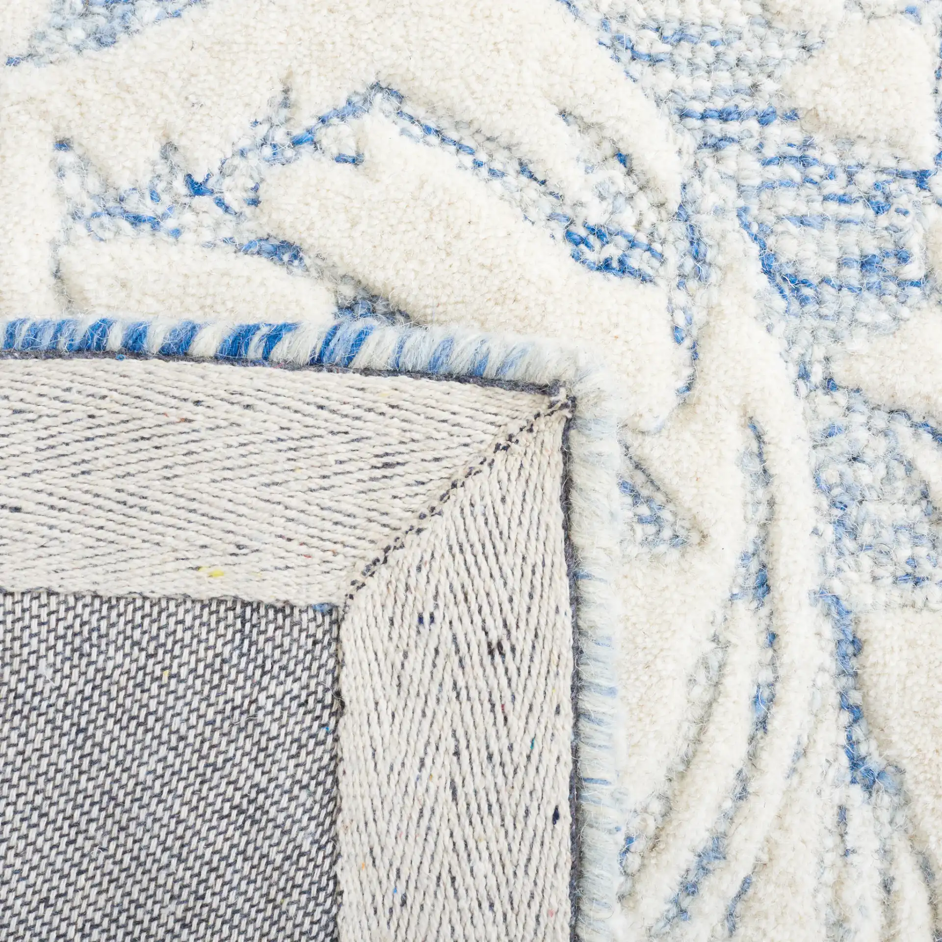 Metro Ornamental Damask Hand-Tufted Wool Rug in Blue / Ivory in a styled room