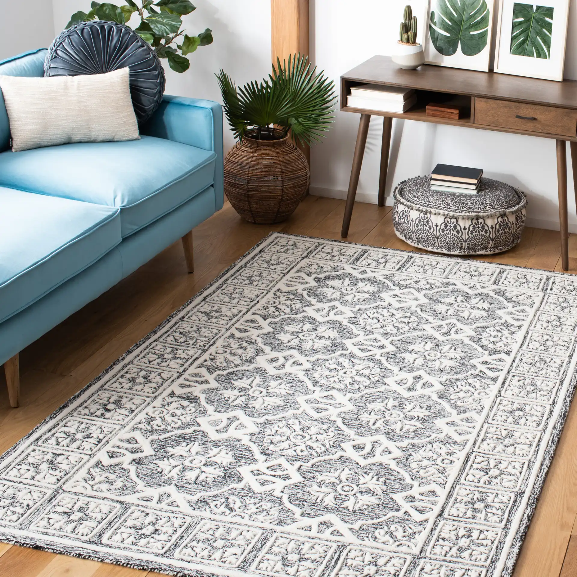 Metro Tile Bordered Hand-Tufted Wool Rug in Black / Ivory in a styled room