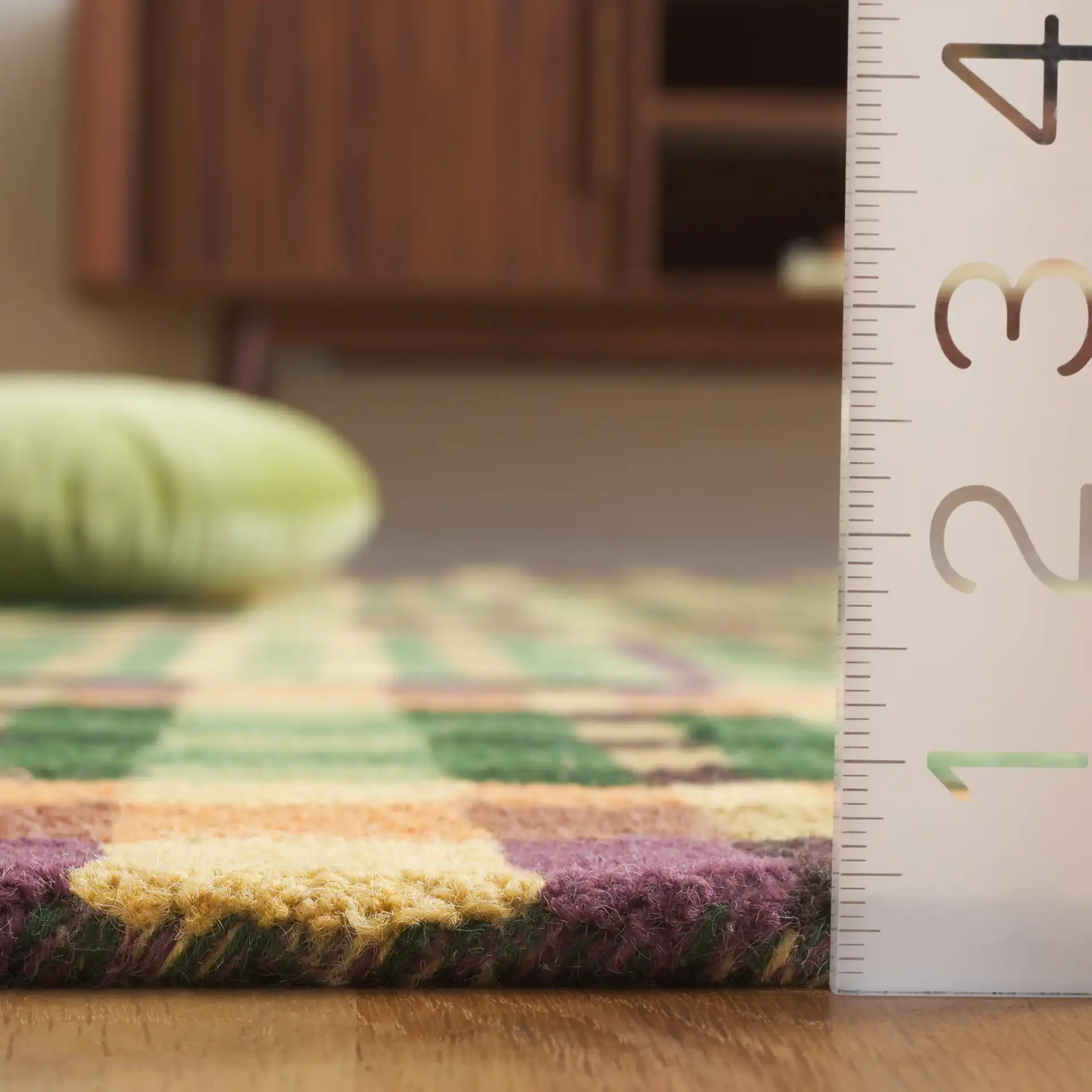 Metro Checkered And Striped Hand-Tufted Wool Rug in Green / Gold in a styled room