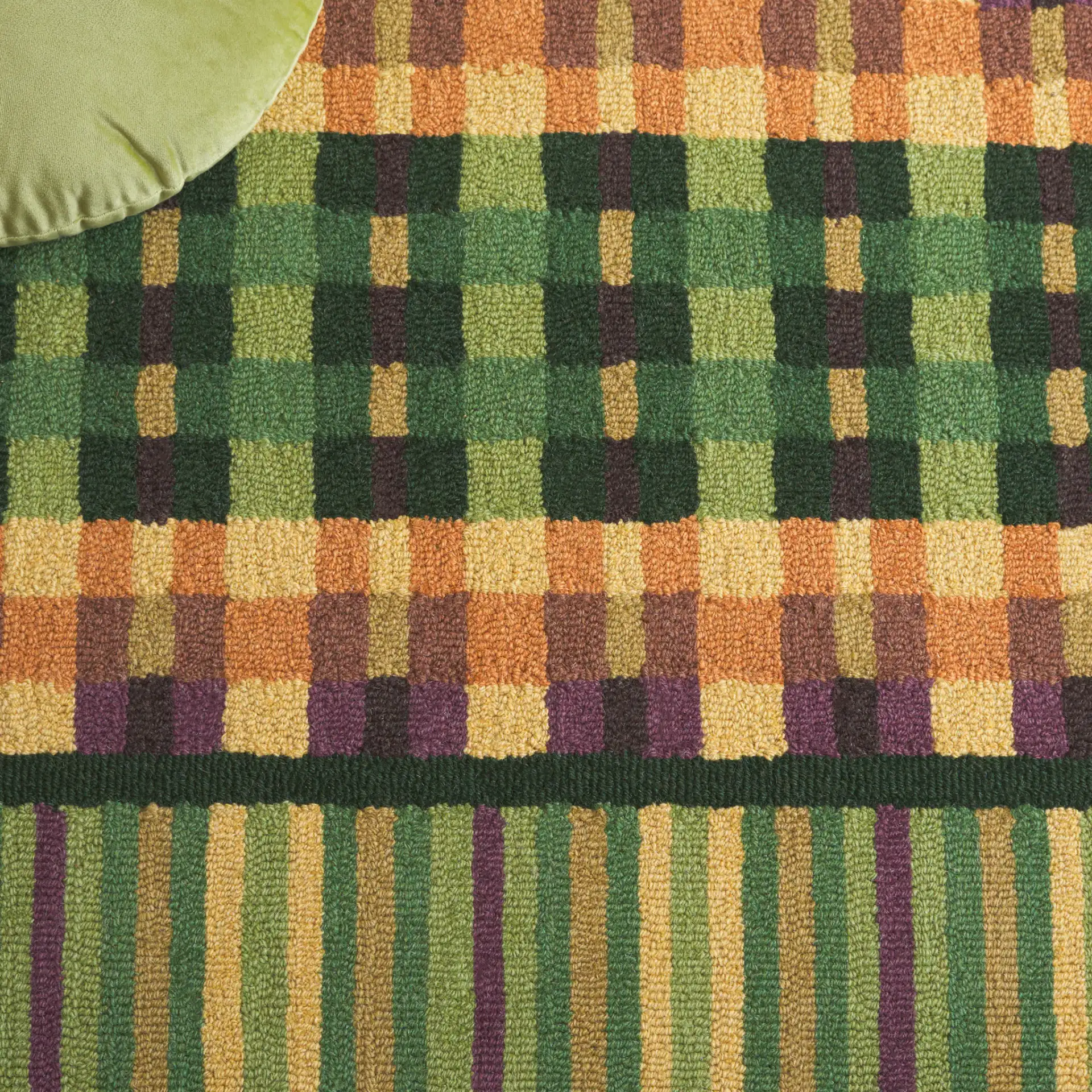Metro Checkered And Striped Hand-Tufted Wool Rug in Green / Gold in a styled room