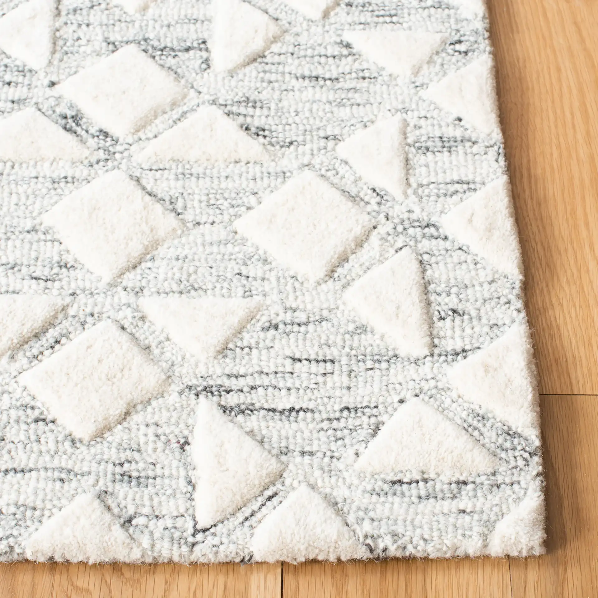 Metro Patchwork Tile Hand-Tufted Wool Rug in Silver / Ivory in a styled room