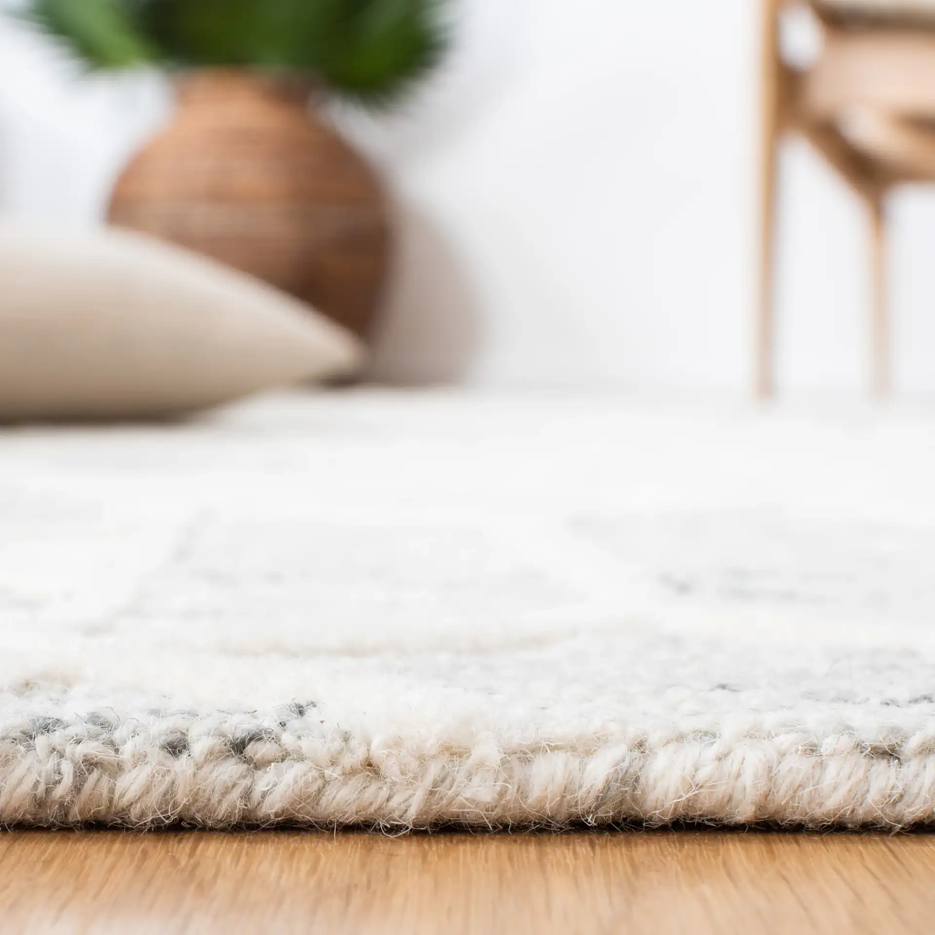Metro Patchwork Tile Hand-Tufted Wool Rug in Silver / Ivory in a styled room