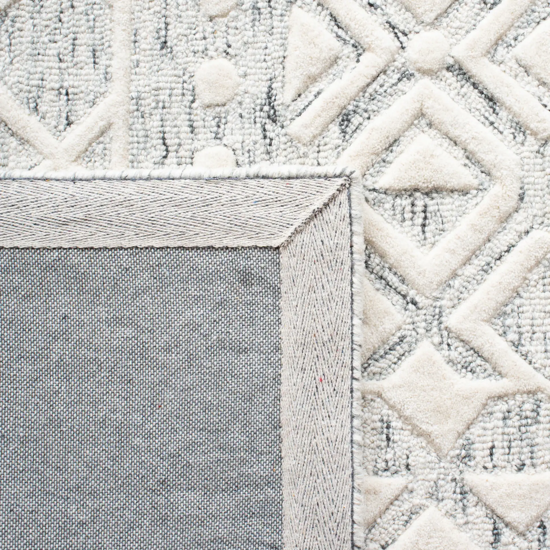 Metro Patchwork Tile Hand-Tufted Wool Rug in Silver / Ivory in a styled room