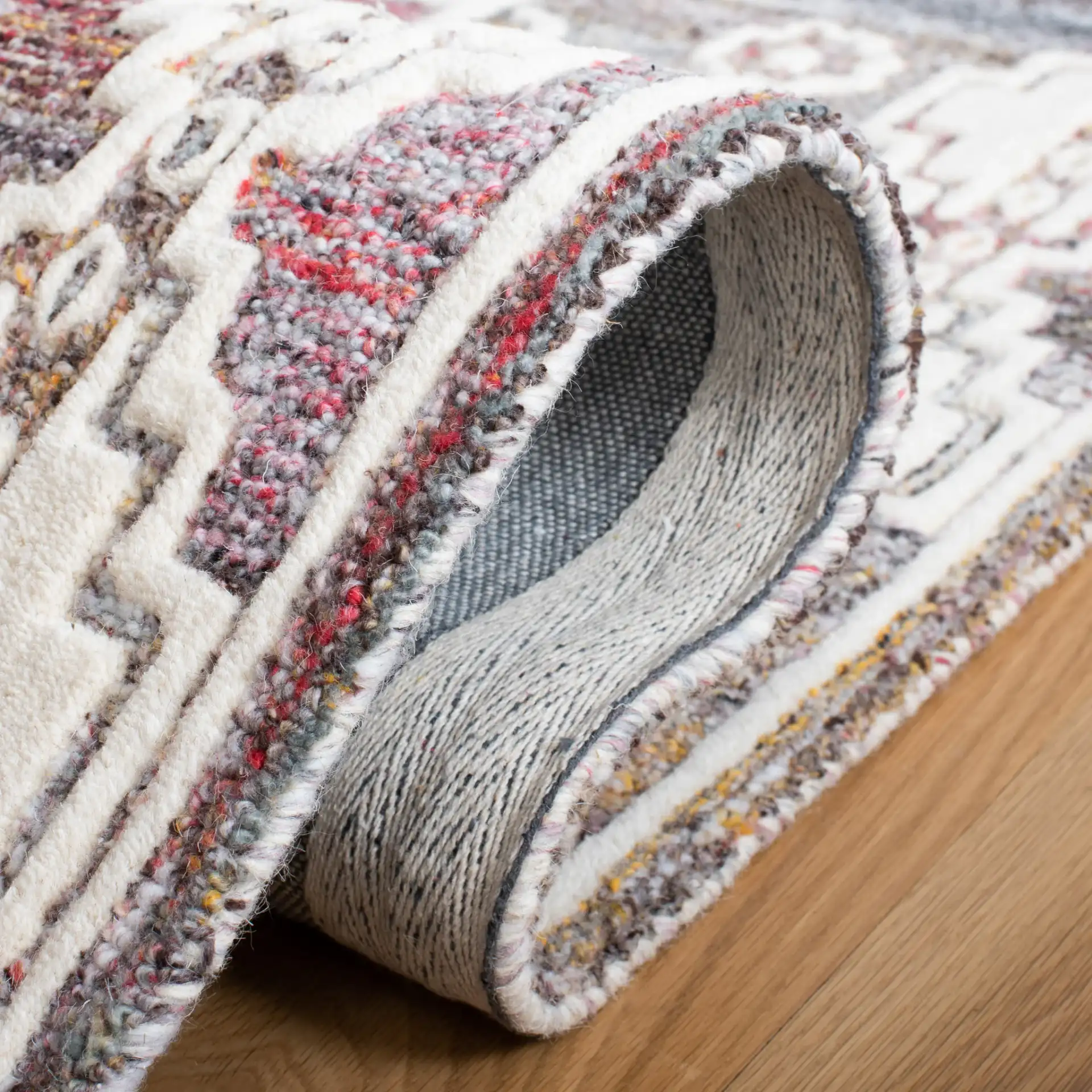 Metro Southwestern Medallion Hand-Tufted Wool Rug in Red / Ivory in a styled room