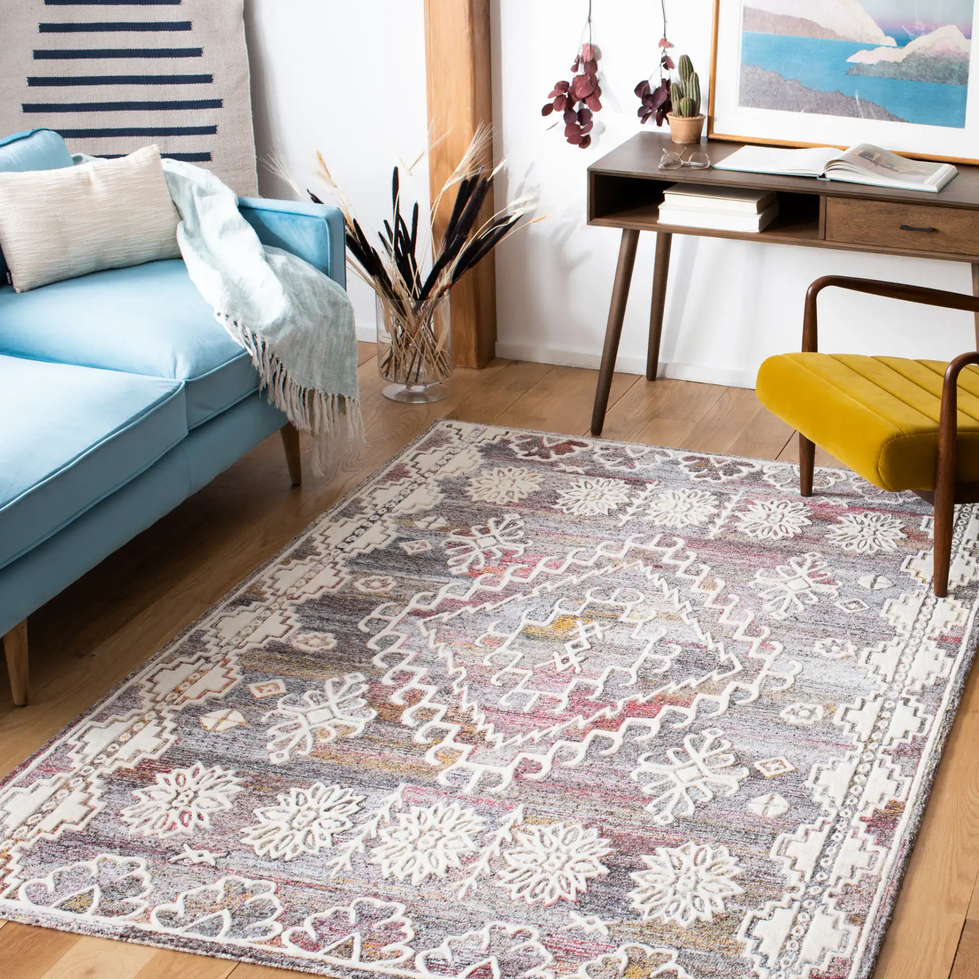 Metro Southwestern Medallion Hand-Tufted Wool Rug in Red / Ivory in a styled room