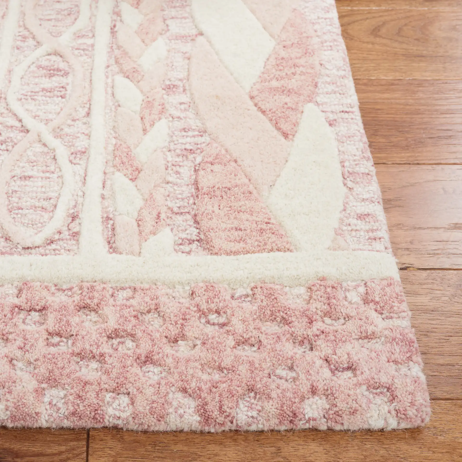 Metro Braided Stripe Hand-Tufted Wool Rug in Pink / Ivory in a styled room