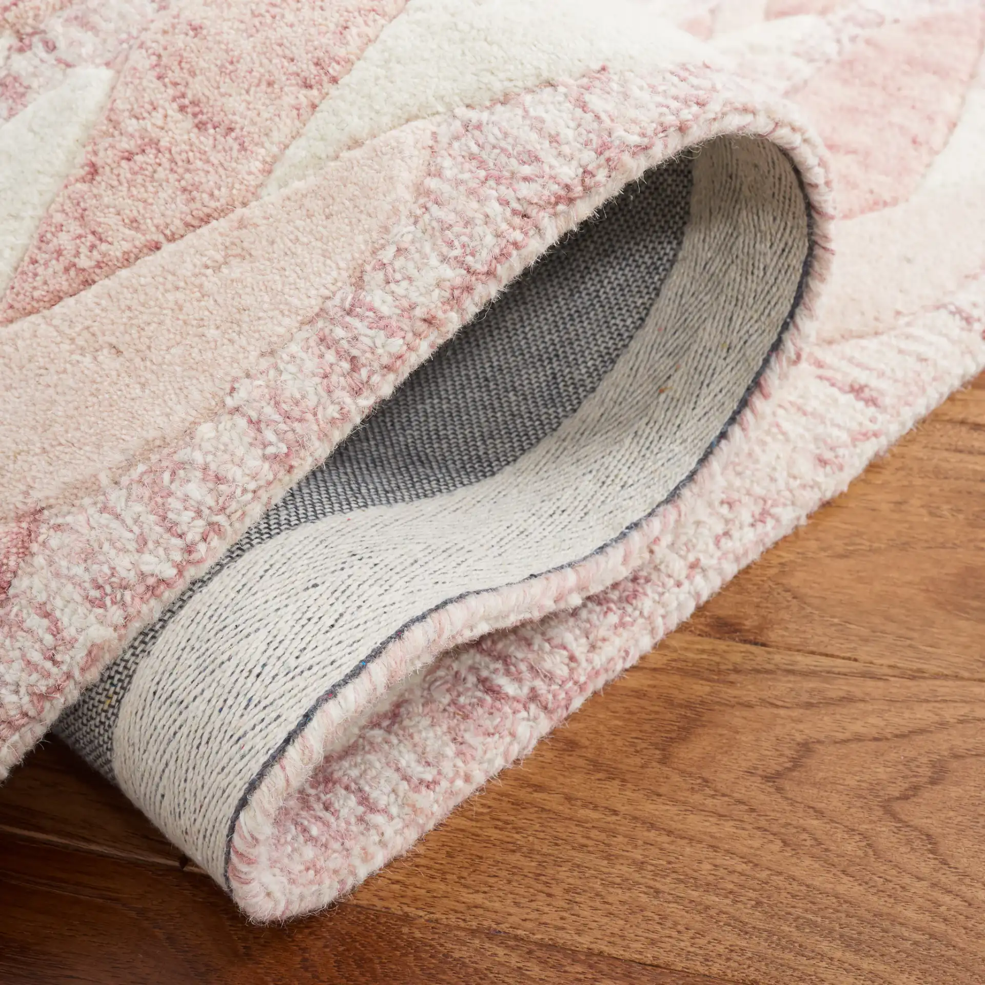 Metro Braided Stripe Hand-Tufted Wool Rug in Pink / Ivory in a styled room