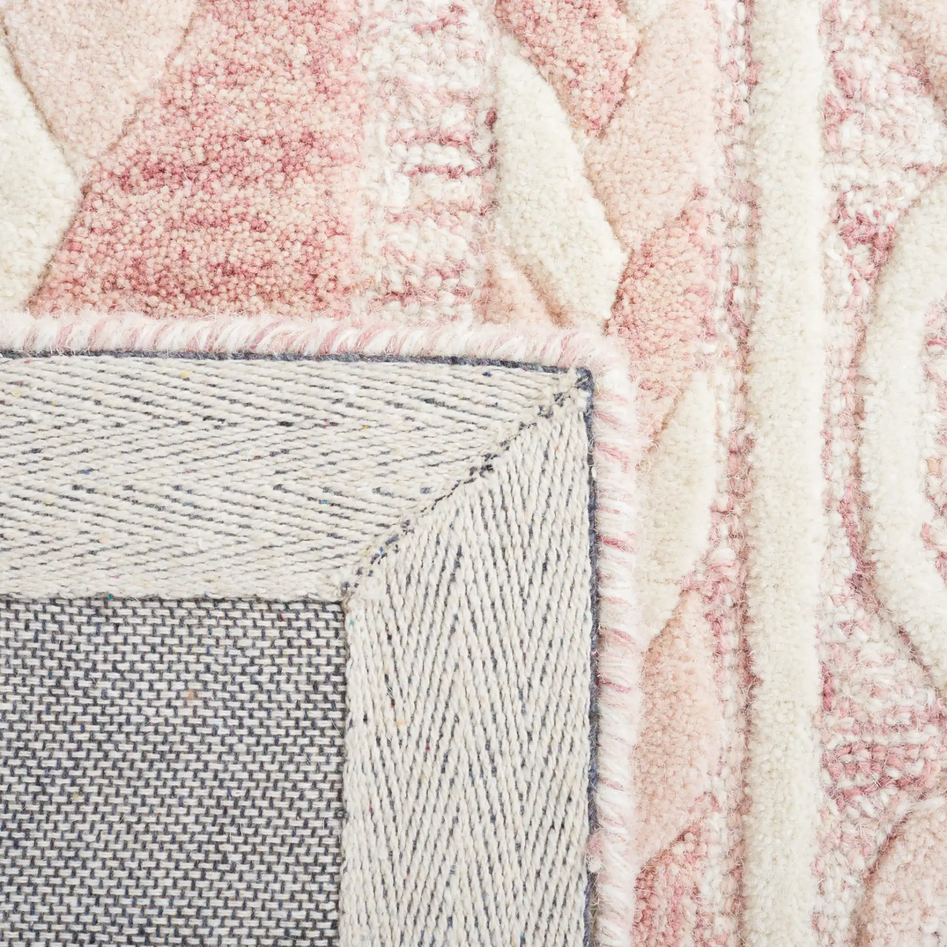 Metro Braided Stripe Hand-Tufted Wool Rug in Pink / Ivory in a styled room