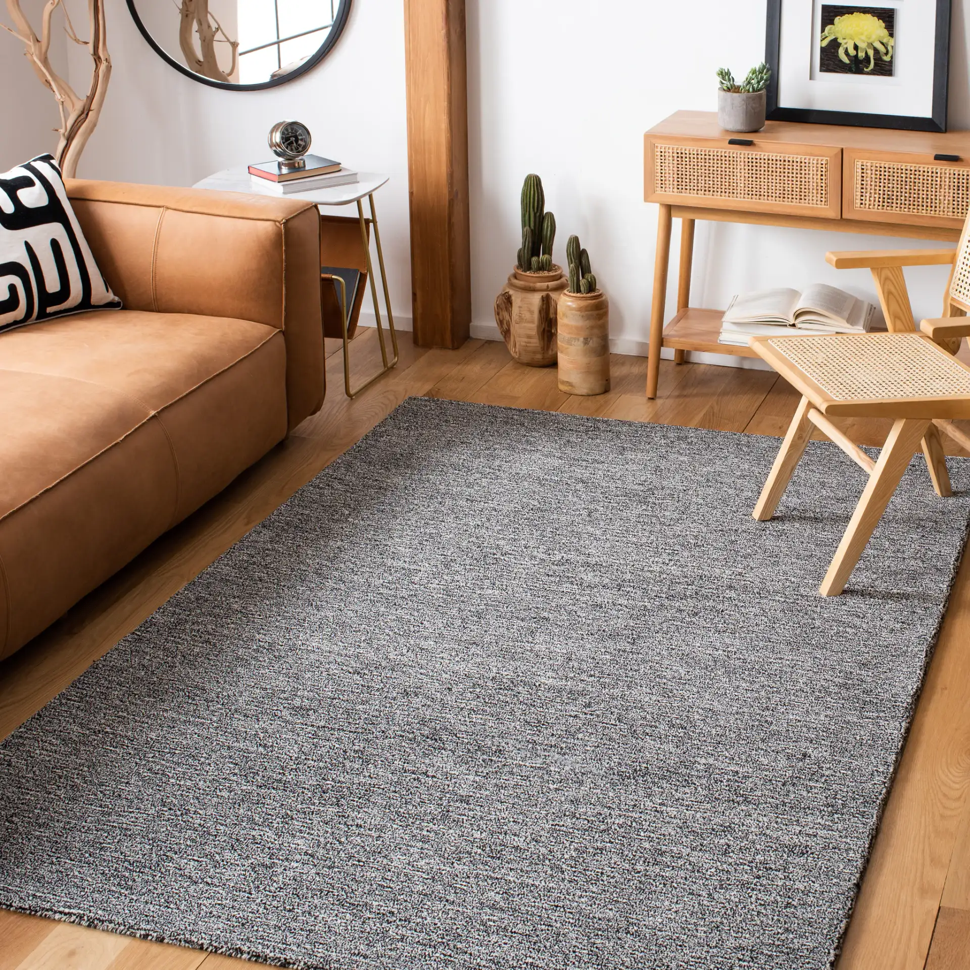 Metro Modern Heathered Solid Hand-Tufted Wool Rug in Black / Ivory in a styled room
