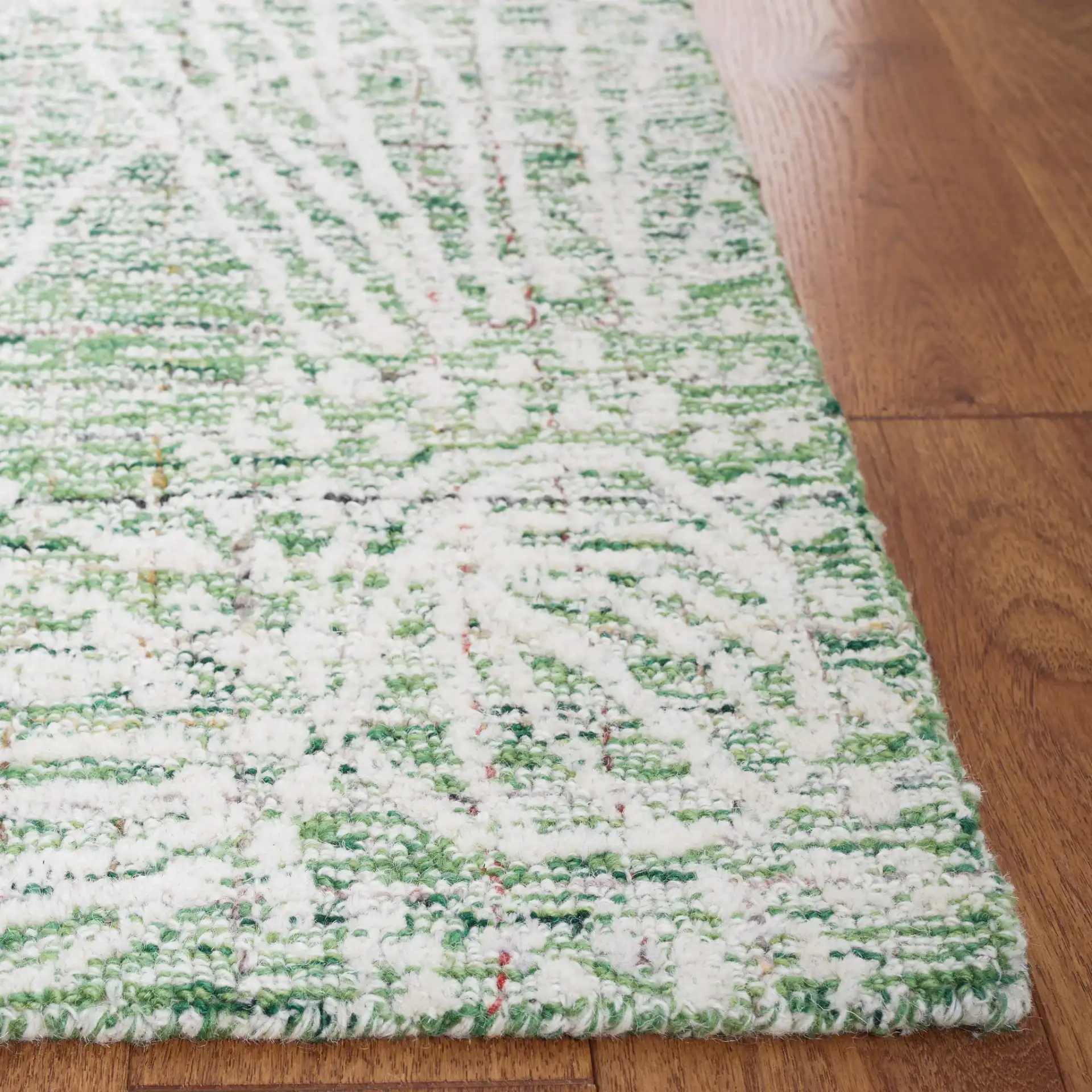 Metro Botanical Hand-Tufted Wool Rug in Green / Ivory in a styled room