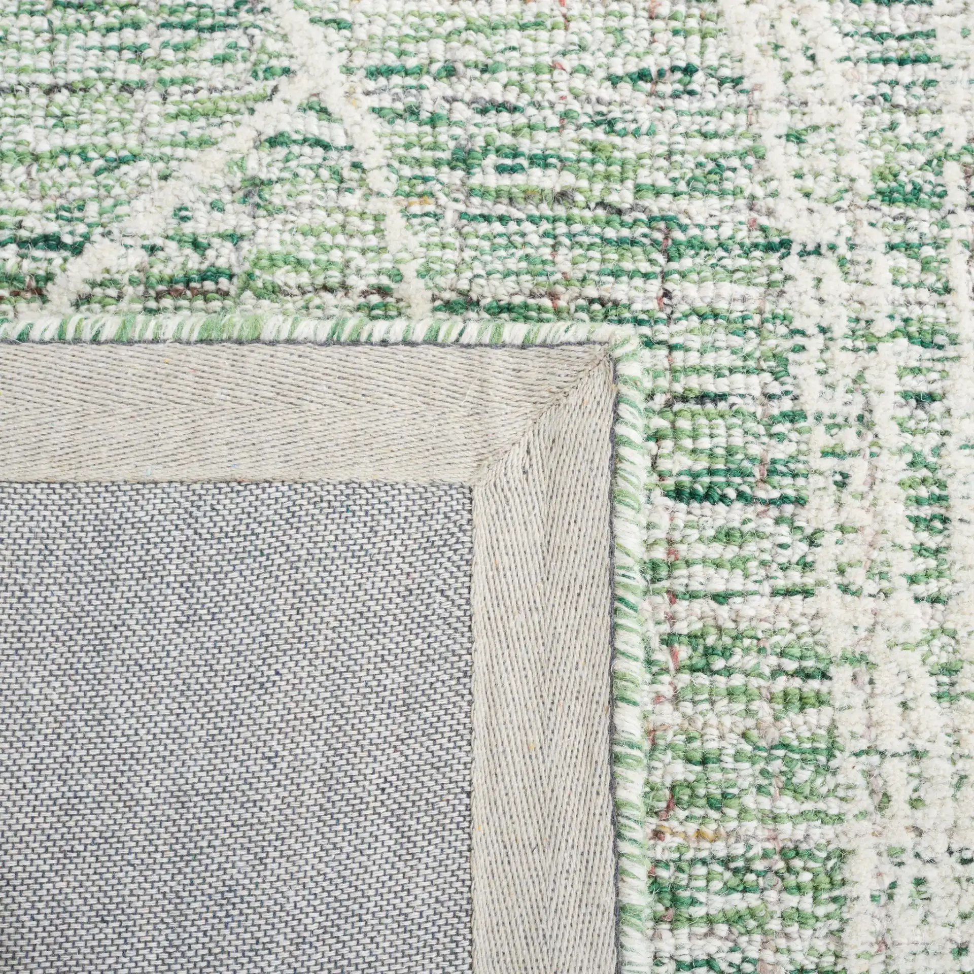 Metro Botanical Hand-Tufted Wool Rug in Green / Ivory in a styled room