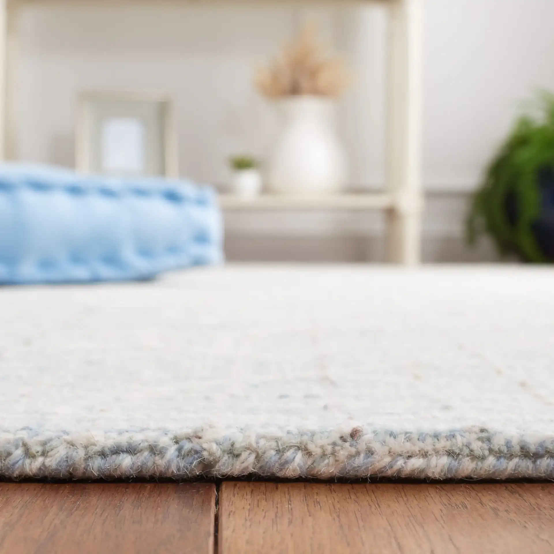 Metro Botanical Grid Hand-Tufted Wool Rug in Blue / Ivory in a styled room