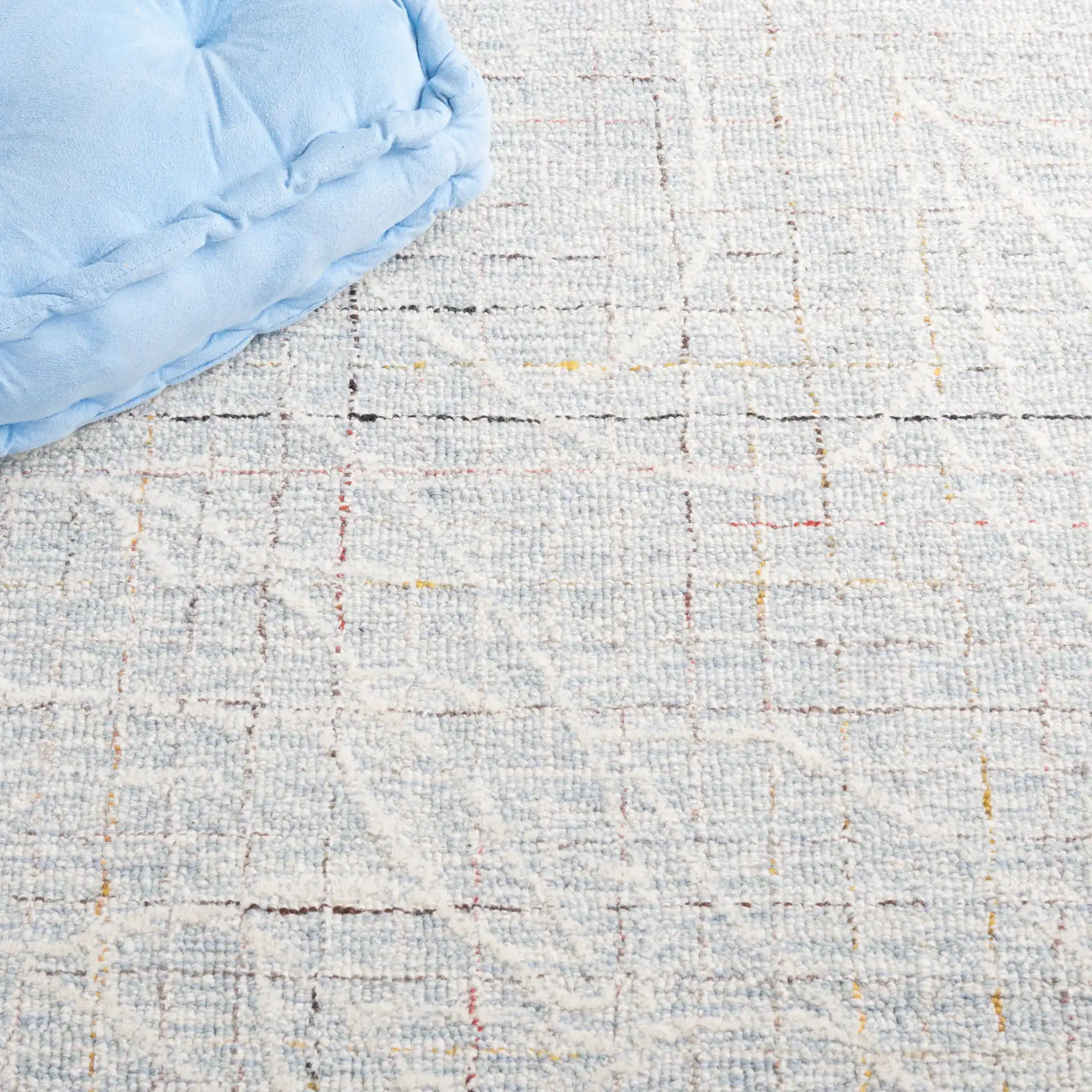 Metro Botanical Grid Hand-Tufted Wool Rug in Blue / Ivory in a styled room