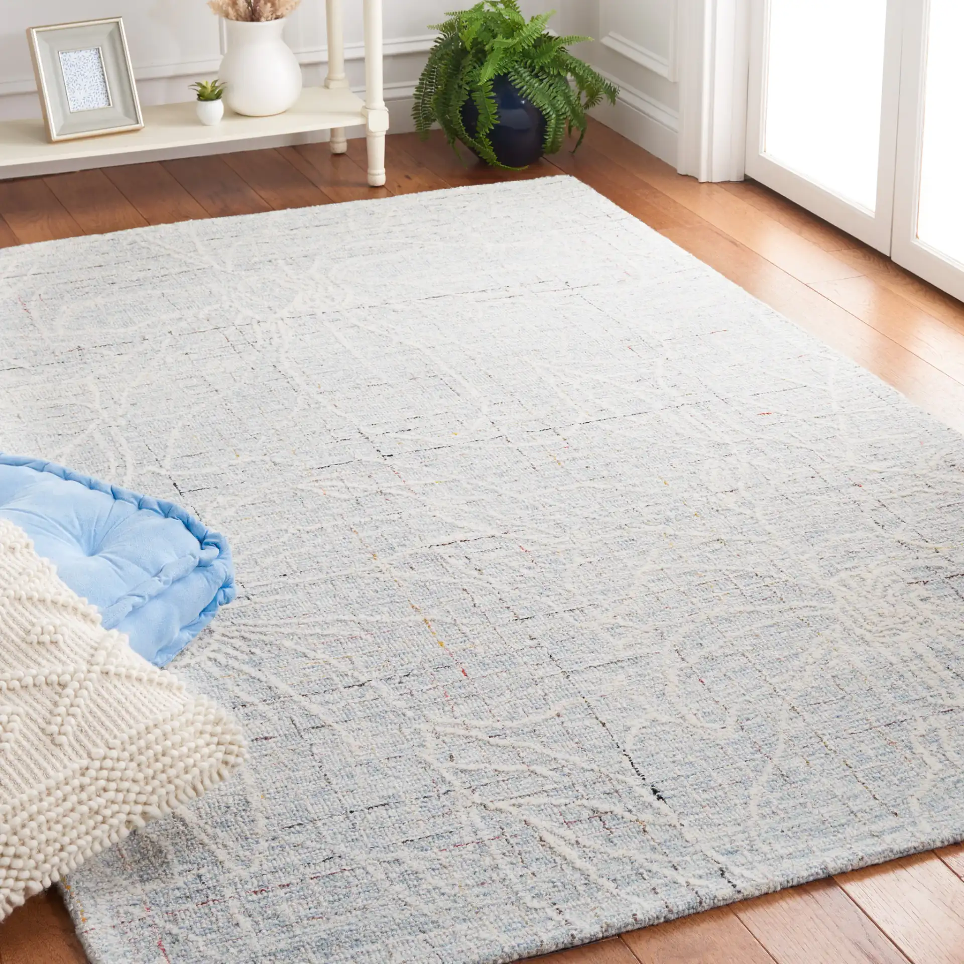 Metro Botanical Grid Hand-Tufted Wool Rug in Blue / Ivory in a styled room