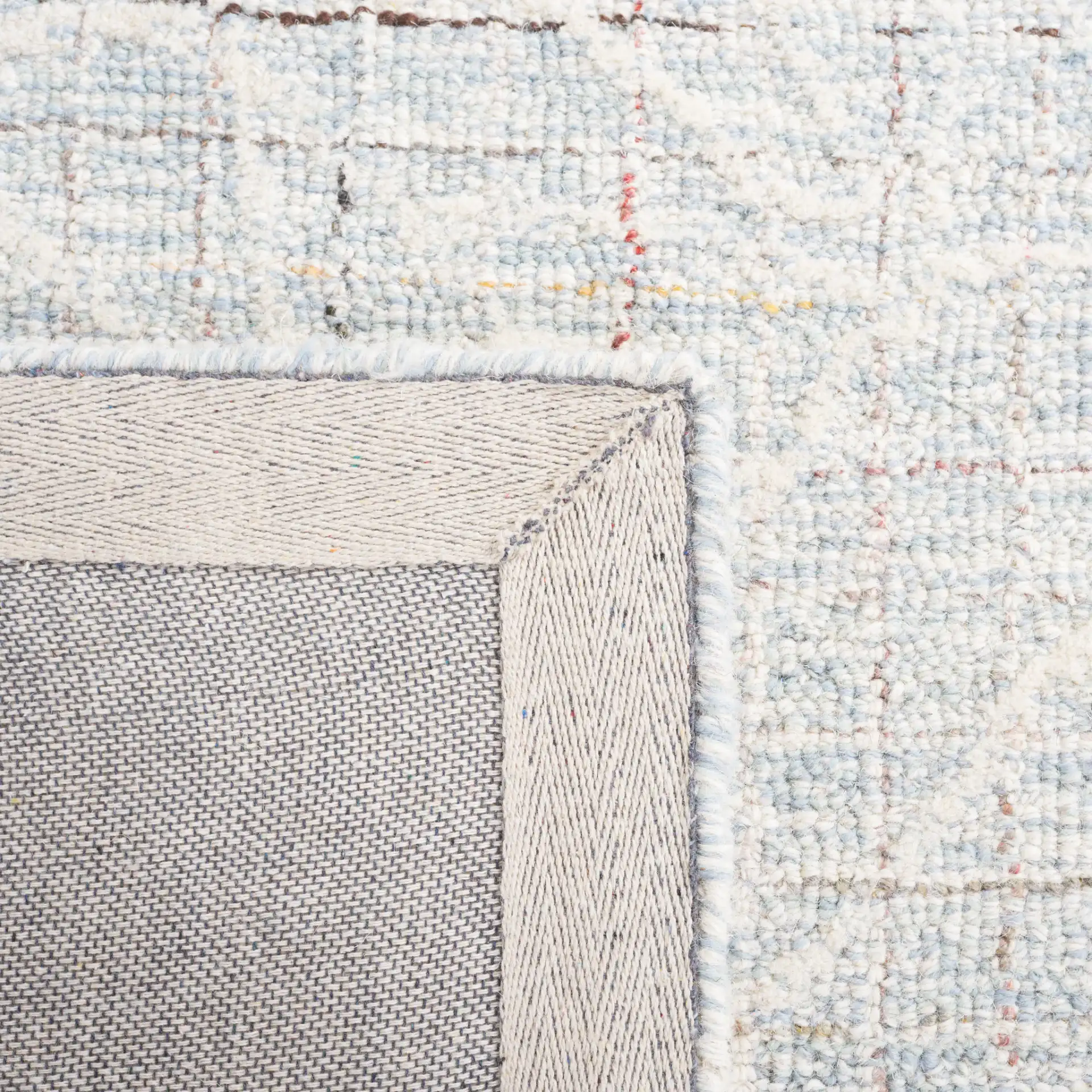 Metro Botanical Grid Hand-Tufted Wool Rug in Blue / Ivory in a styled room
