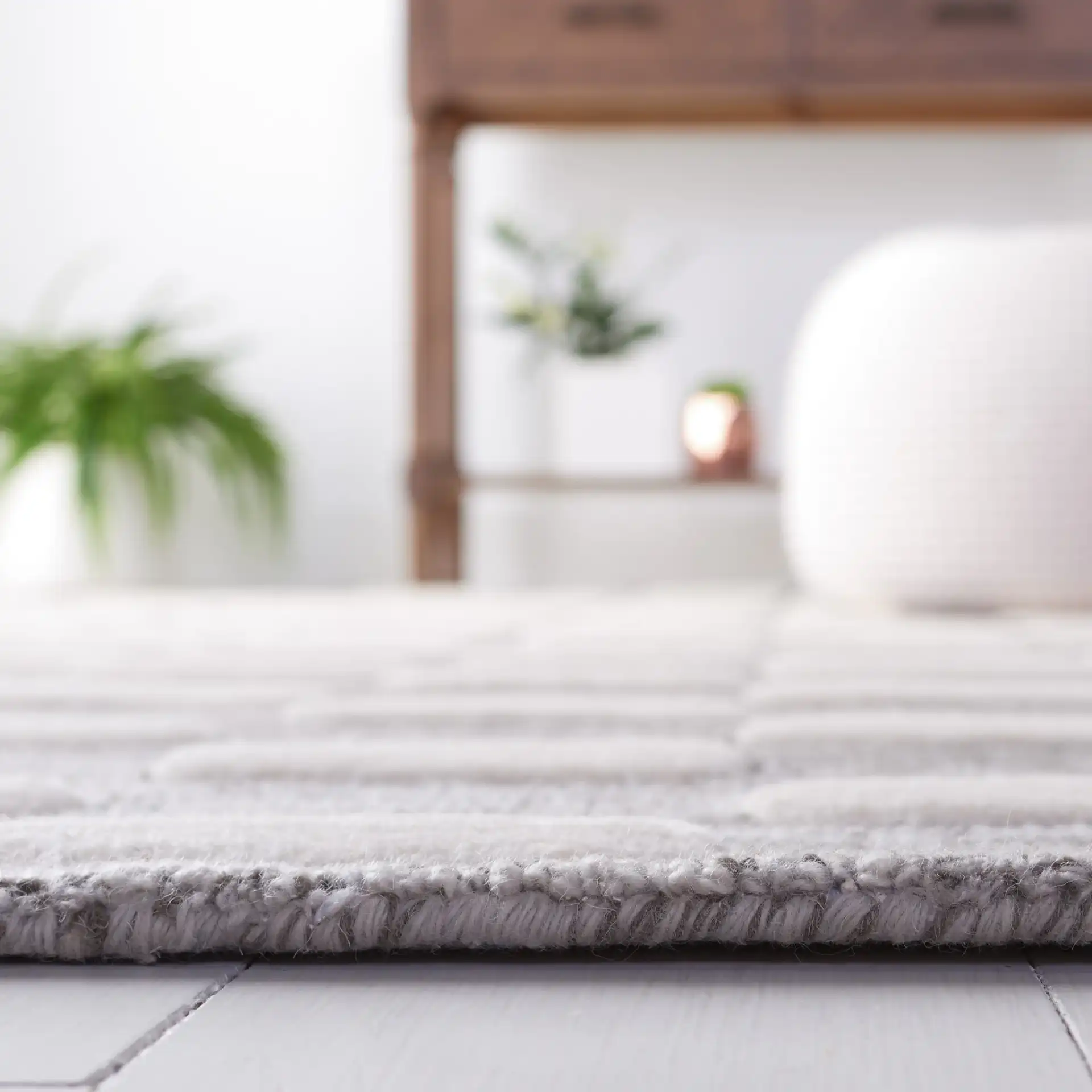 Metro Gradient Dash Hand-Tufted Wool Rug in Black / Ivory in a styled room