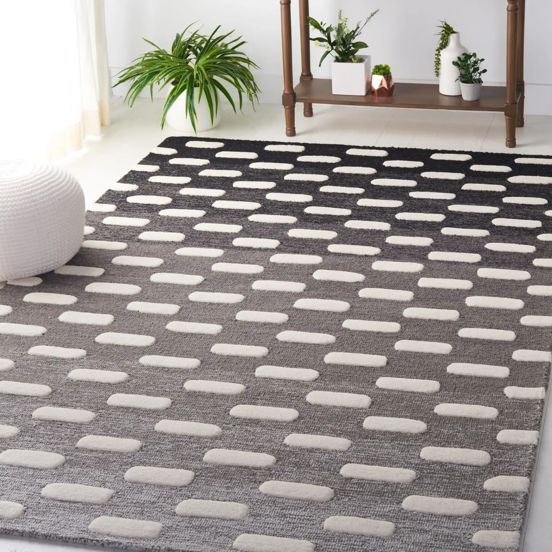 Metro Gradient Dash Hand-Tufted Wool Rug in Black / Ivory in a styled room