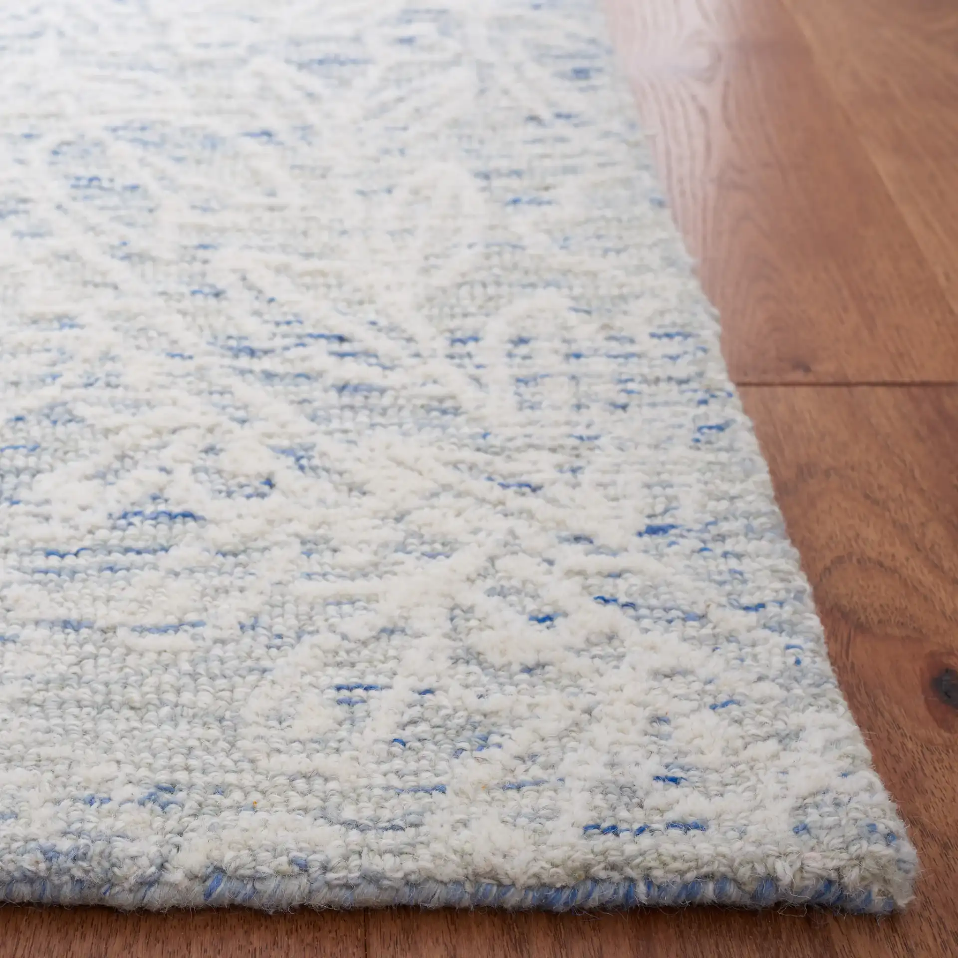 Metro Damask Trellis Hand-Tufted Wool Rug in Blue / Ivory in a styled room