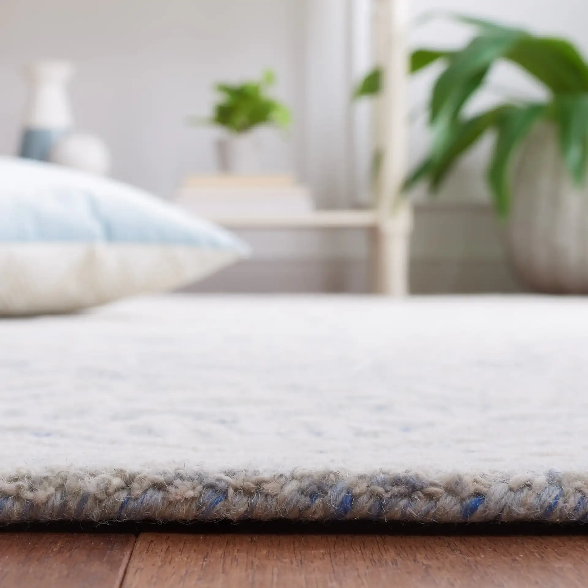 Metro Damask Trellis Hand-Tufted Wool Rug in Blue / Ivory in a styled room