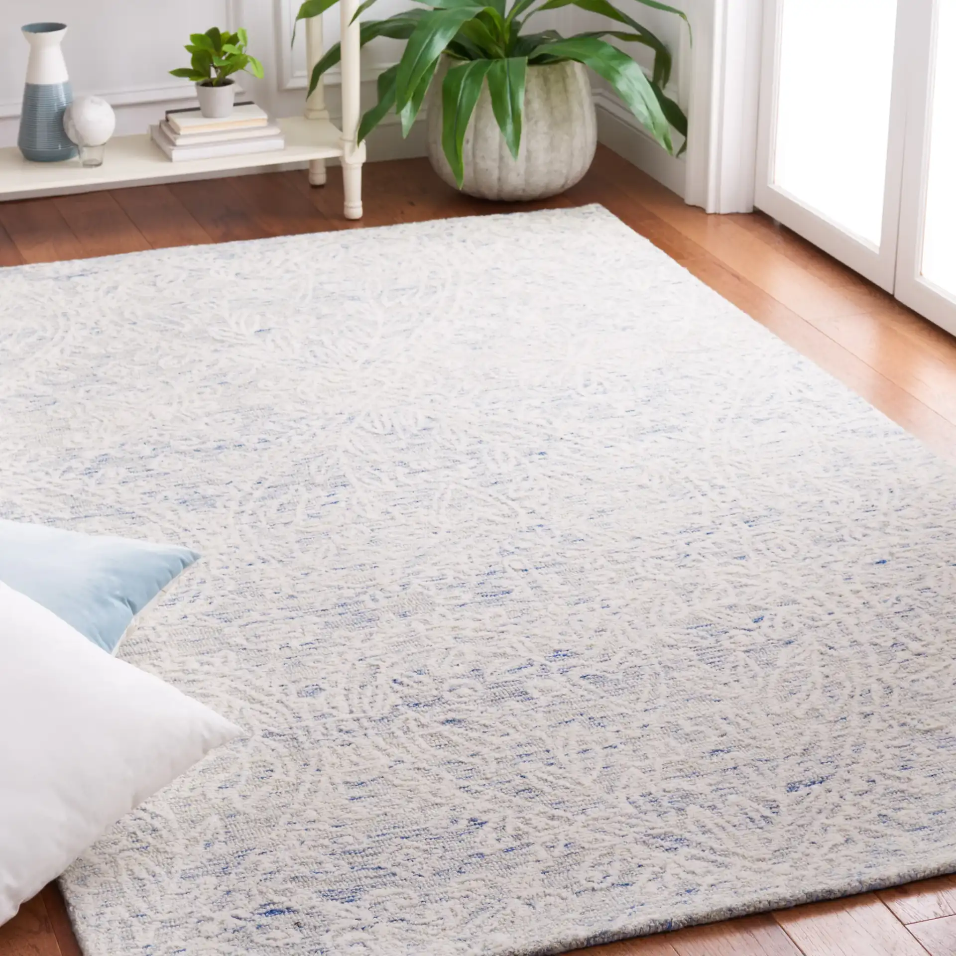 Metro Damask Trellis Hand-Tufted Wool Rug in Blue / Ivory in a styled room