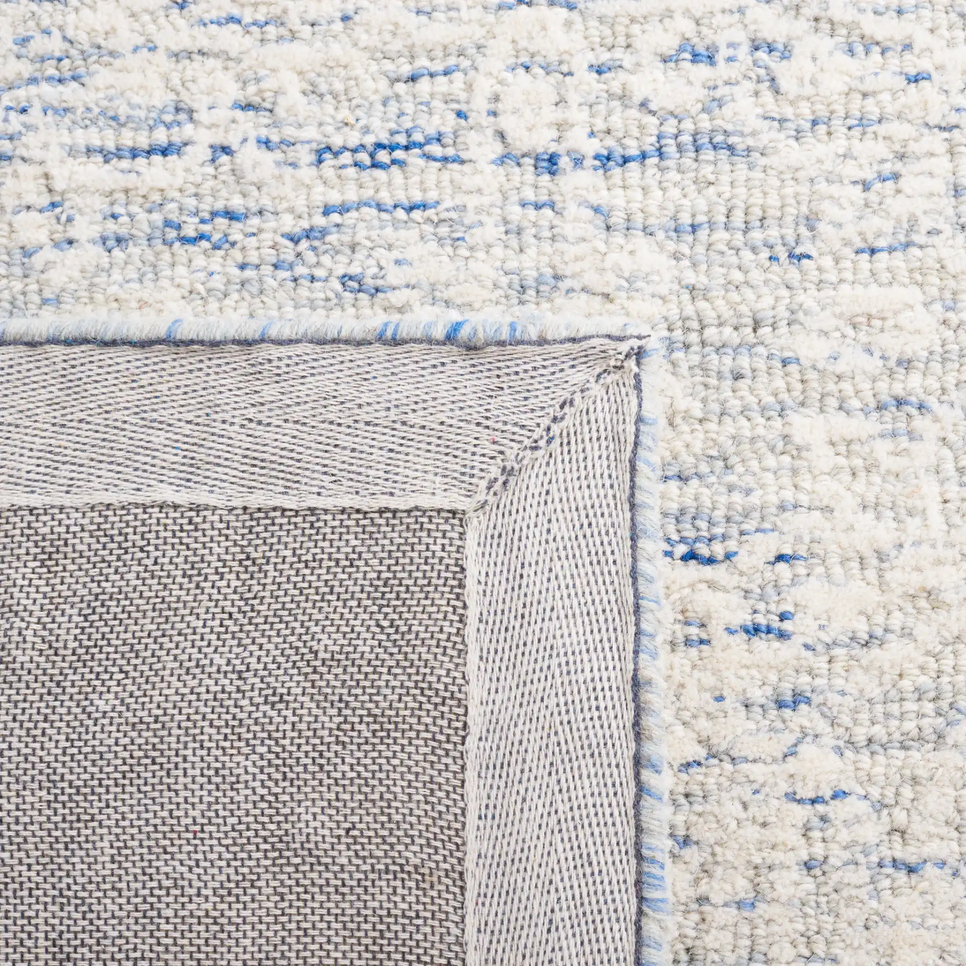 Metro Damask Trellis Hand-Tufted Wool Rug in Blue / Ivory in a styled room