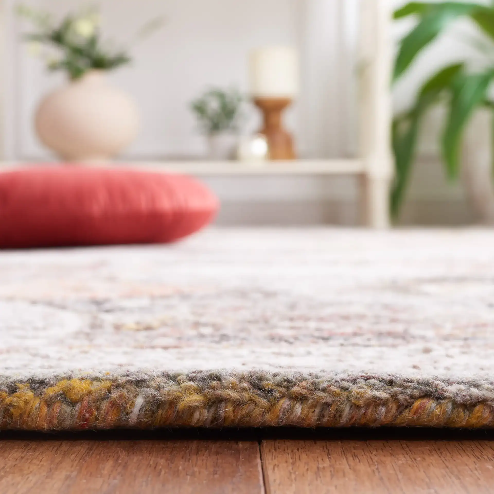 Metro Overlapping Medallion Hand-Tufted Wool Rug in Ivory / Red in a styled room