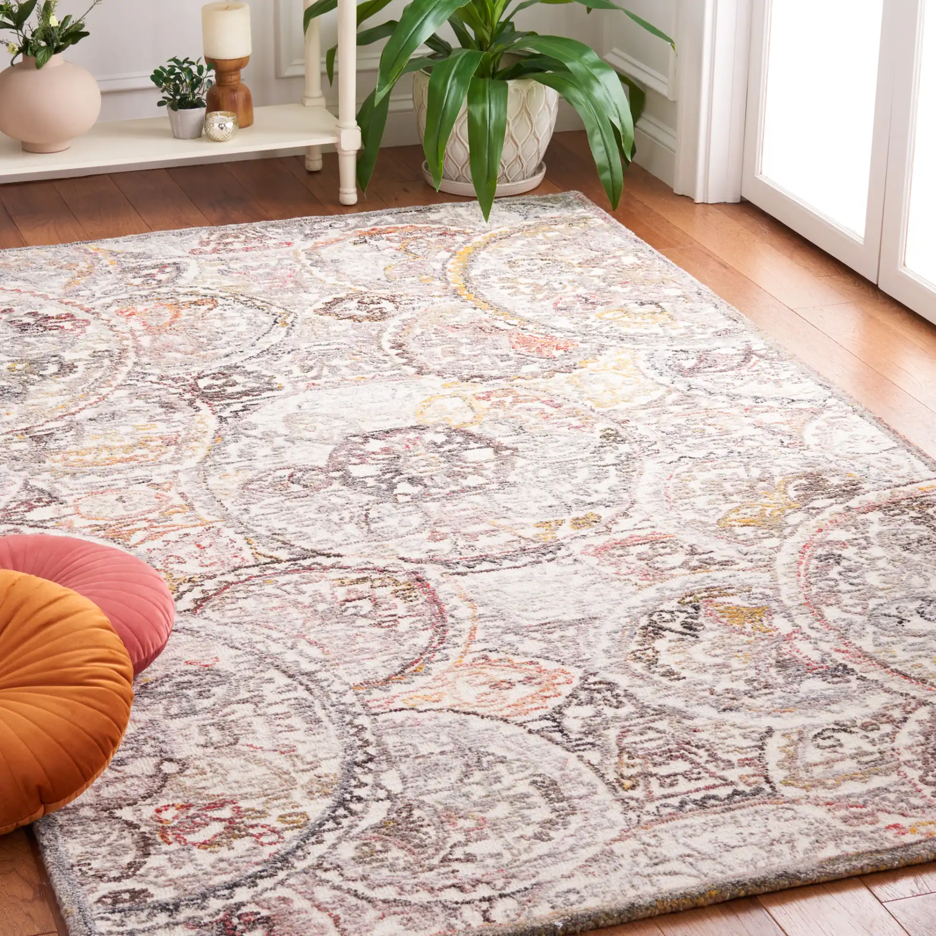 Metro Overlapping Medallion Hand-Tufted Wool Rug in Ivory / Red in a styled room
